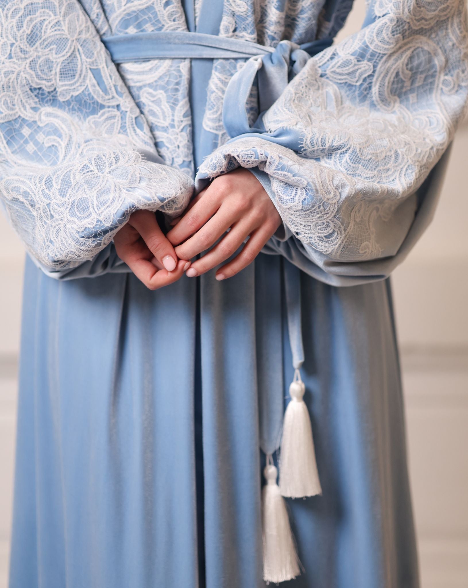 Artistic focus on the waistline belt, highlighting the warmth and weight of the high-quality winter velvet.