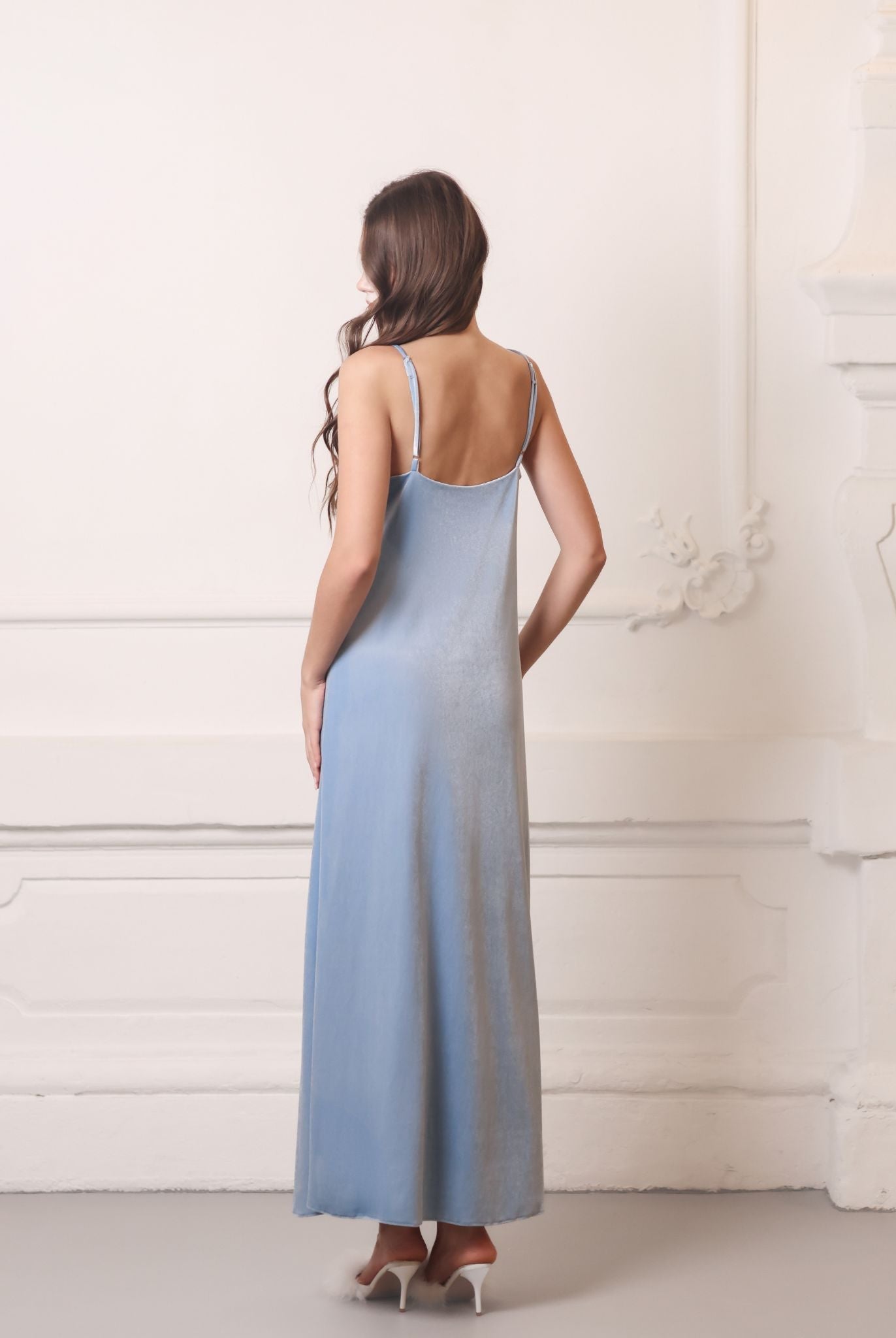 Rear view of a bias-cut velvet nightdress, highlighting the smooth texture and flattering fit along the body.