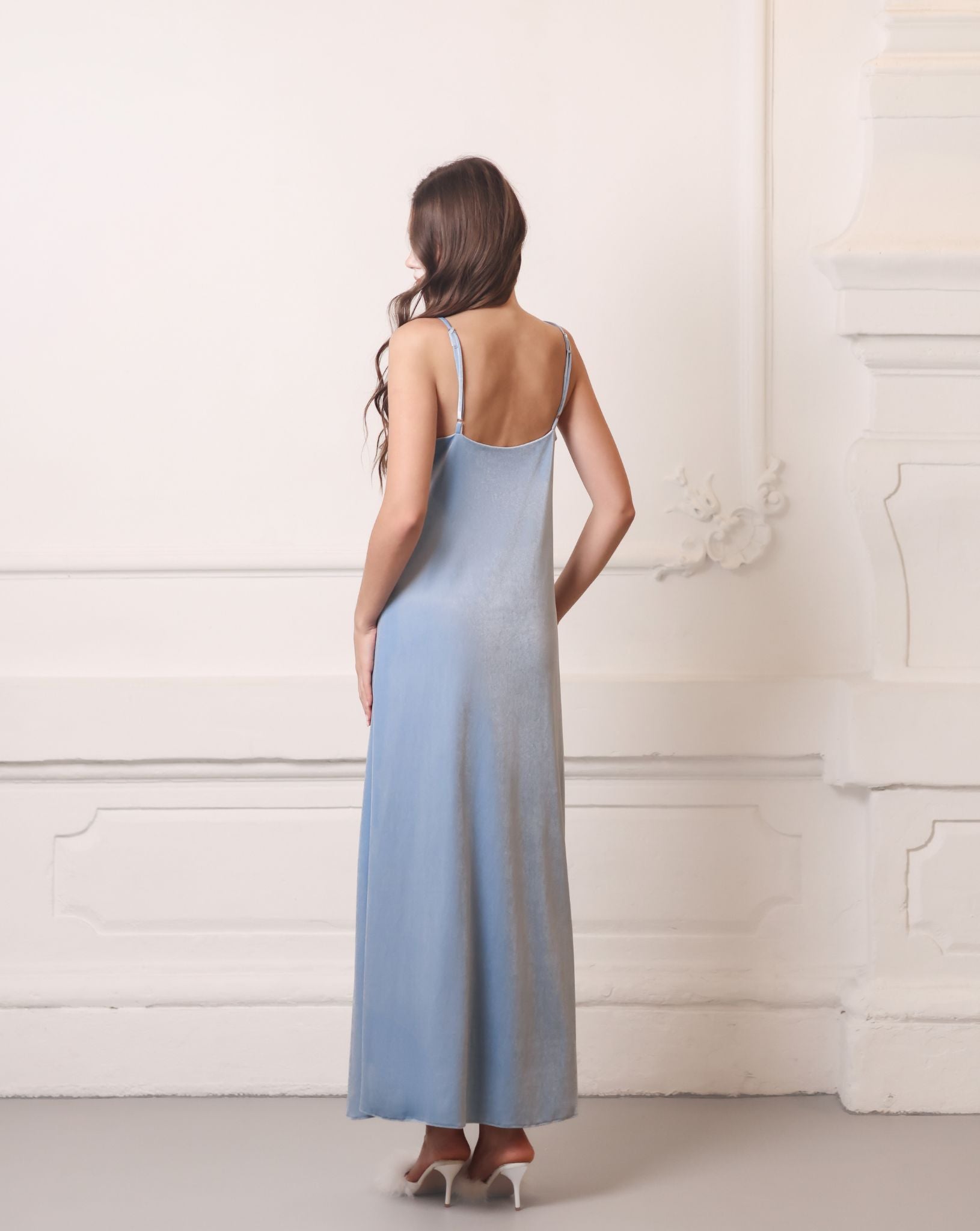 Rear view of a bias-cut velvet nightdress, highlighting the smooth texture and flattering fit along the body.