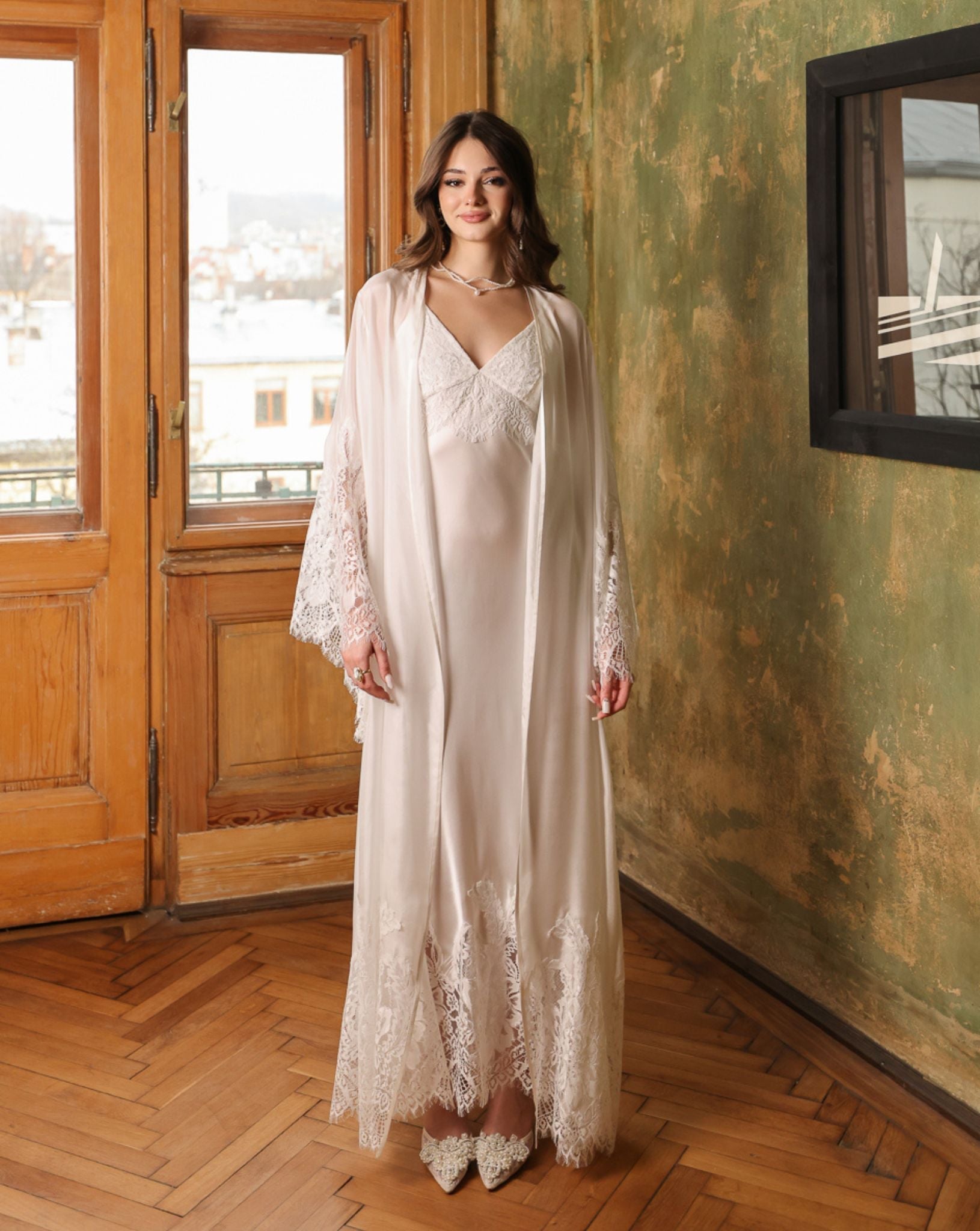 Static front view of the white silk ensemble, emphasizing the minimalist elegance and premium fabric quality.