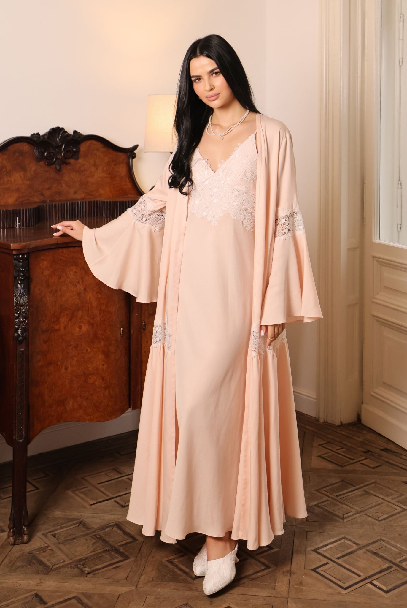 An atmospheric full-length shot of the Cotton Robe set, highlighting its serene presence and natural comfort.