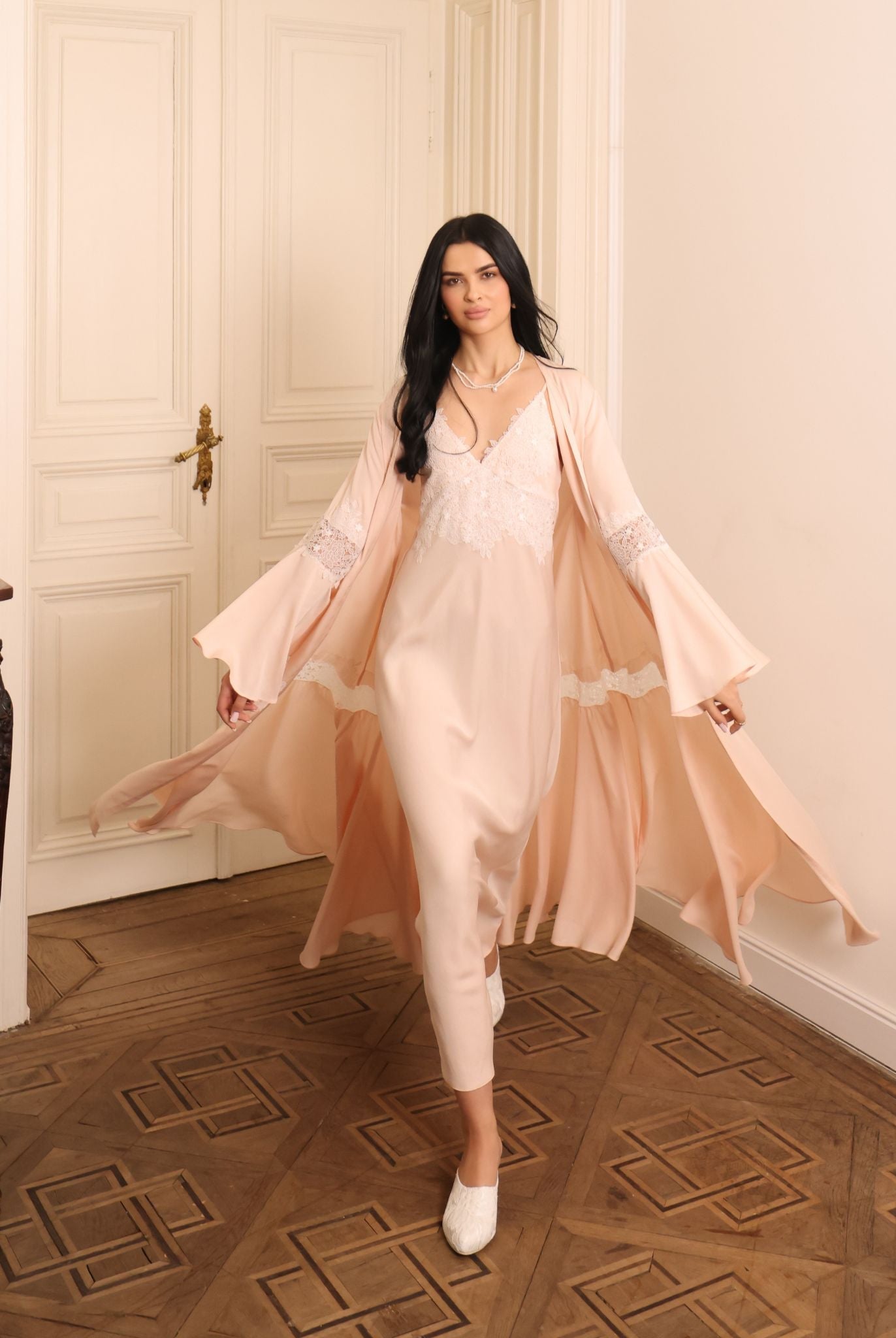 A dynamic view of the flowing set in motion, showcasing its airy silhouette and effortless grace during movement.