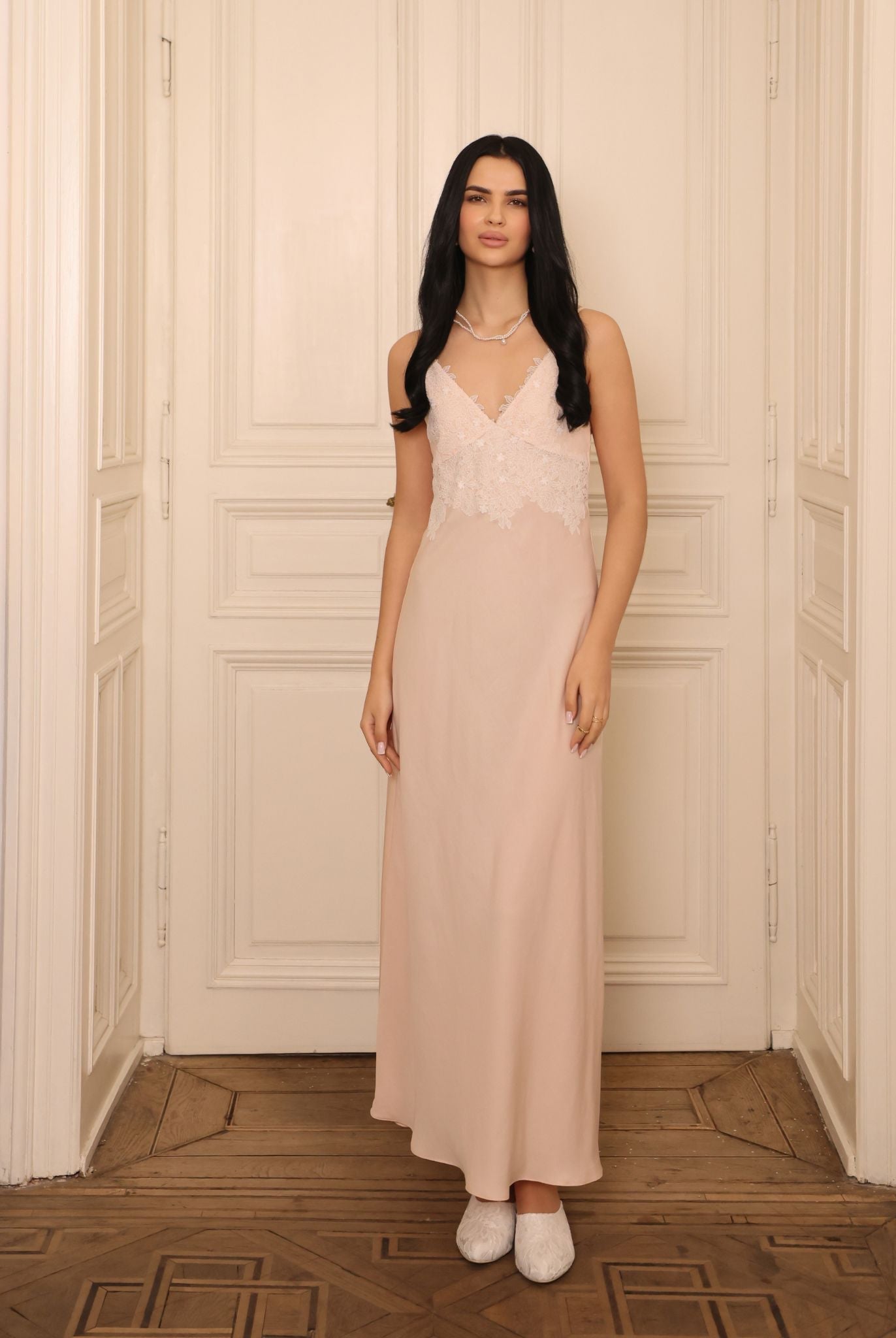 Frontal view of the cotton-viscose slip dress, featuring delicate lace detailing along the feminine neckline.