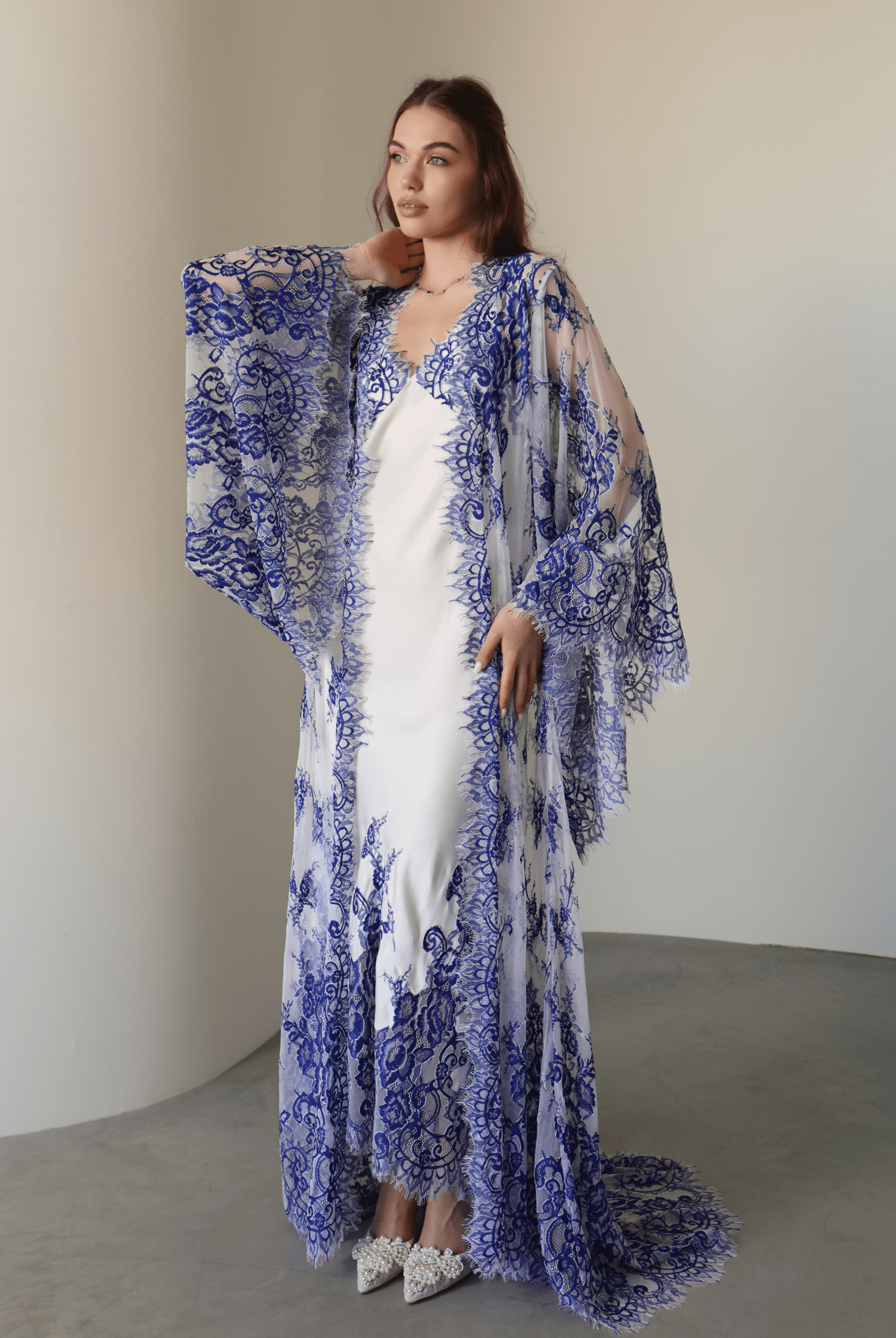 A full-length shot of the Robe and Nightgown Set, capturing the airy lace and effortless feminine style.