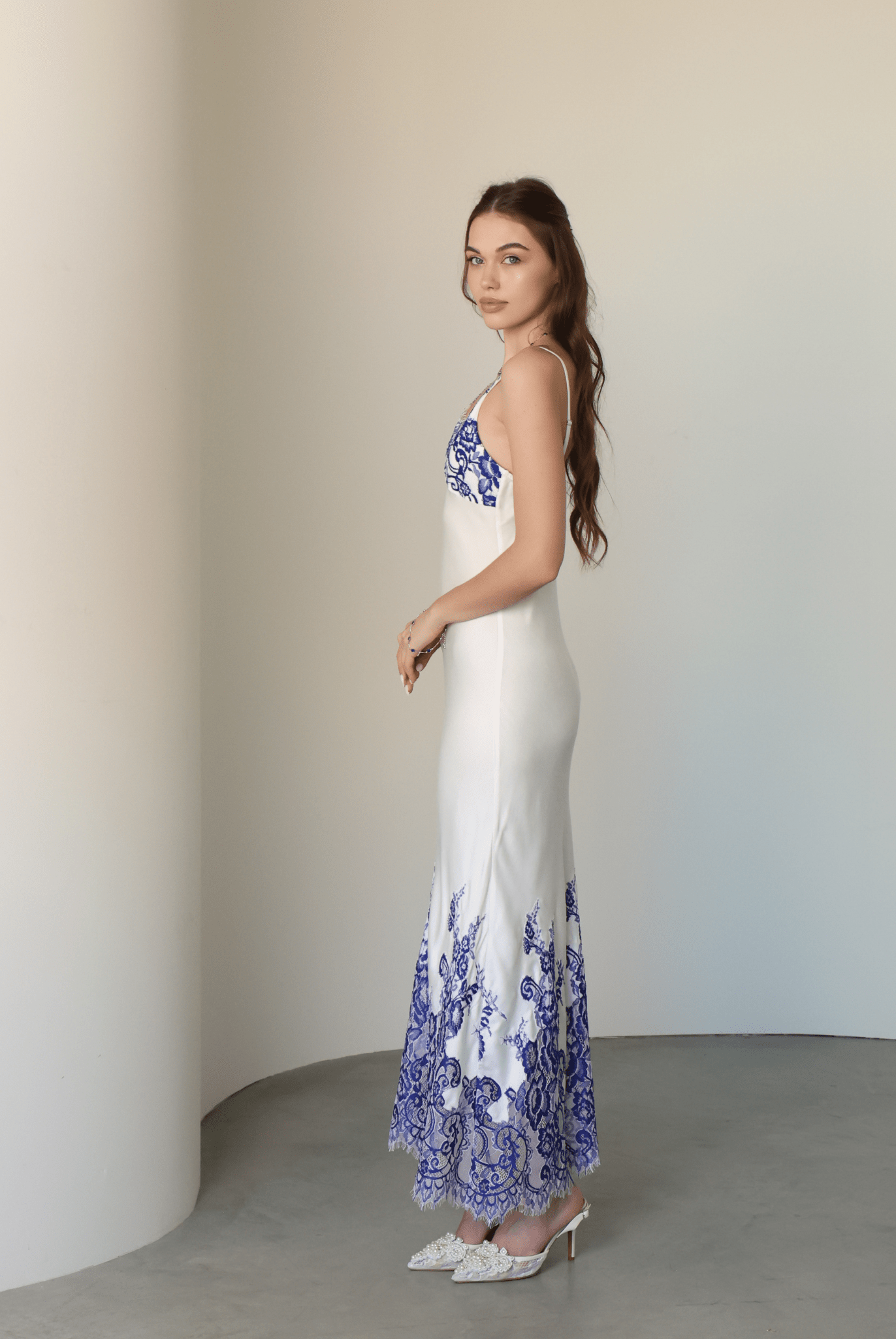 Side view of the sleeveless nightgown, highlighting the soft natural fabric and its clean, simple lines.