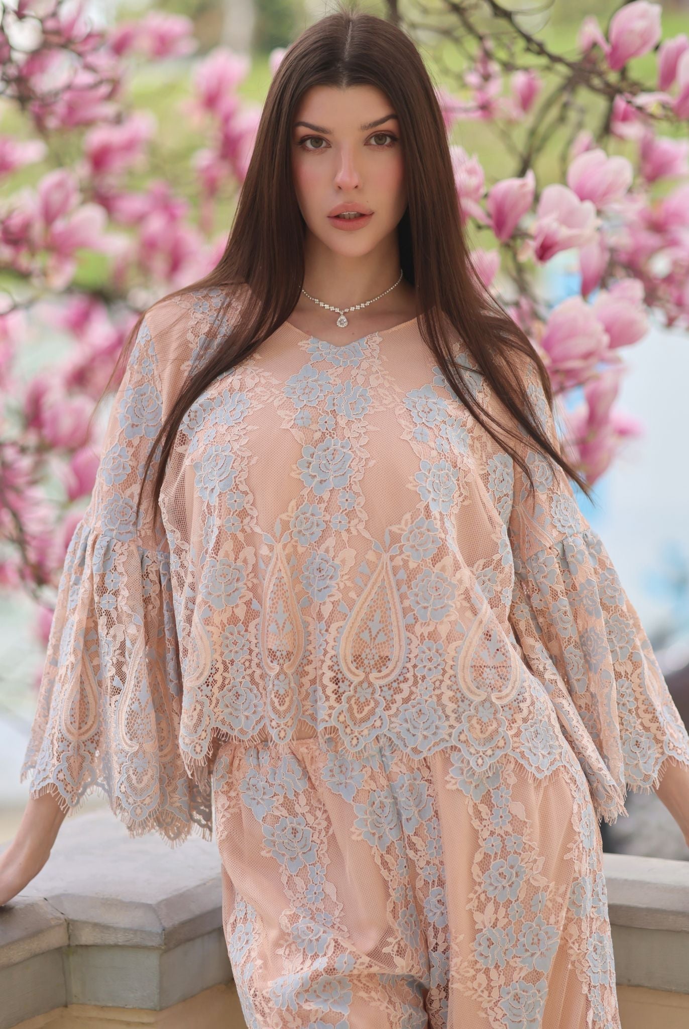 A mid-length shot of the Pajama Pants and Top, showcasing the V-shaped neckline and graceful movement of the top.