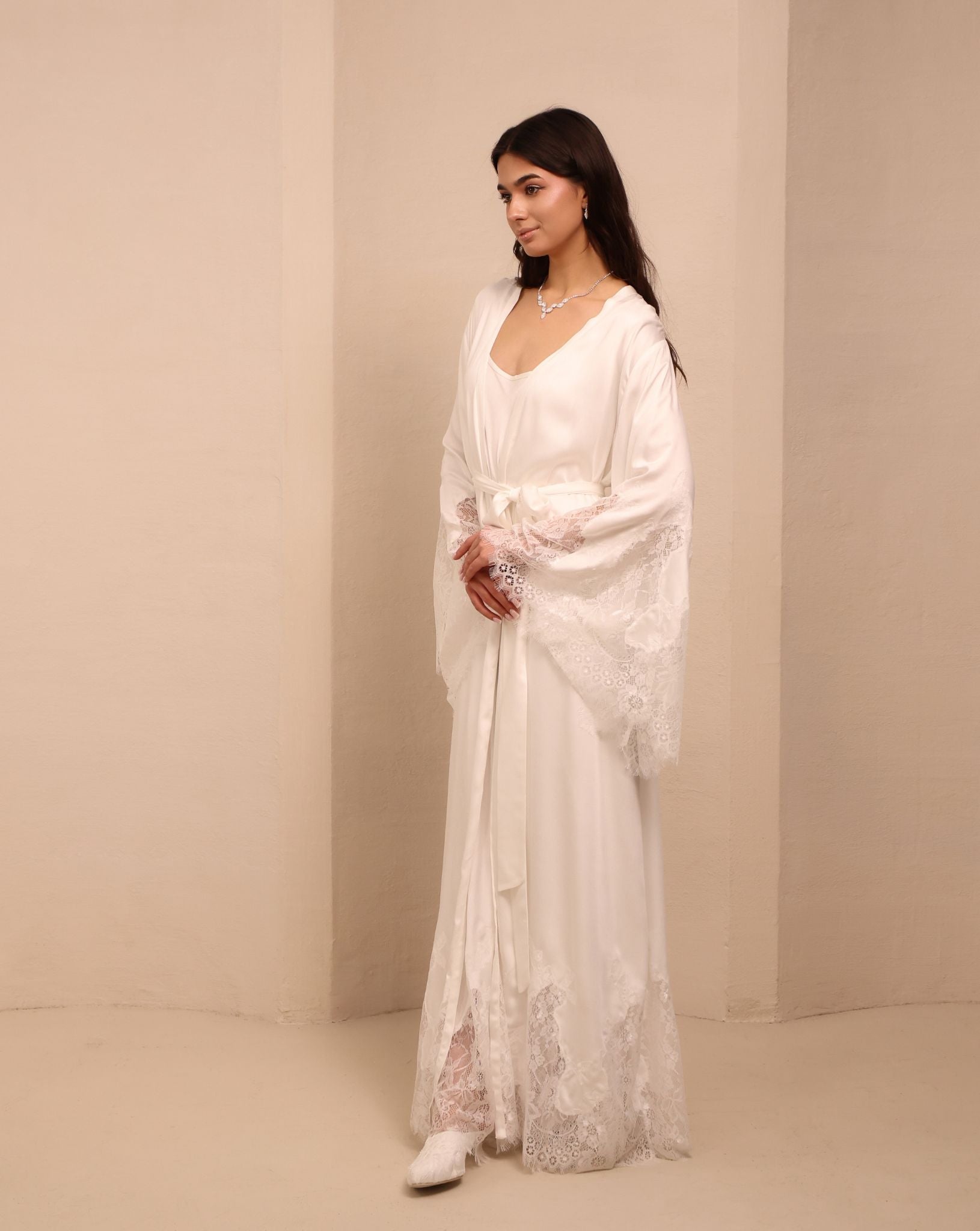 A dynamic shot of the white Robe and Nightgown Set in motion, balancing functionality with romantic beauty.