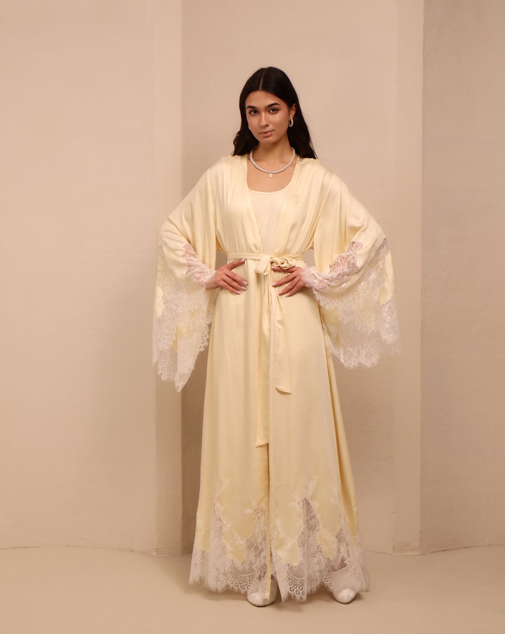 A poised shot of the tied nightgown, showcasing the flattering fit that adapts as the body changes.