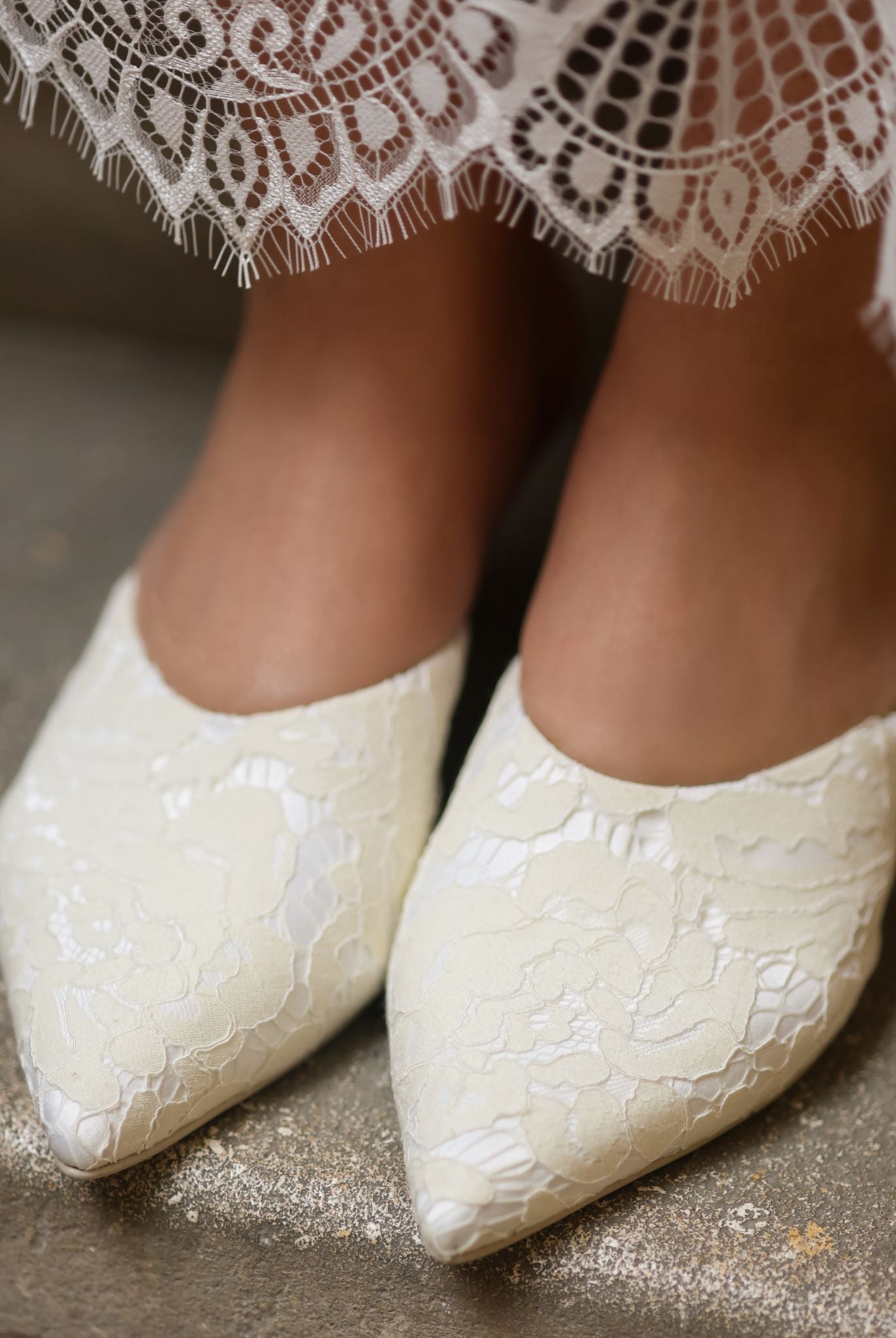 A high-angle shot of the footwear on feet, illustrating how the satin base follows the foot's form.