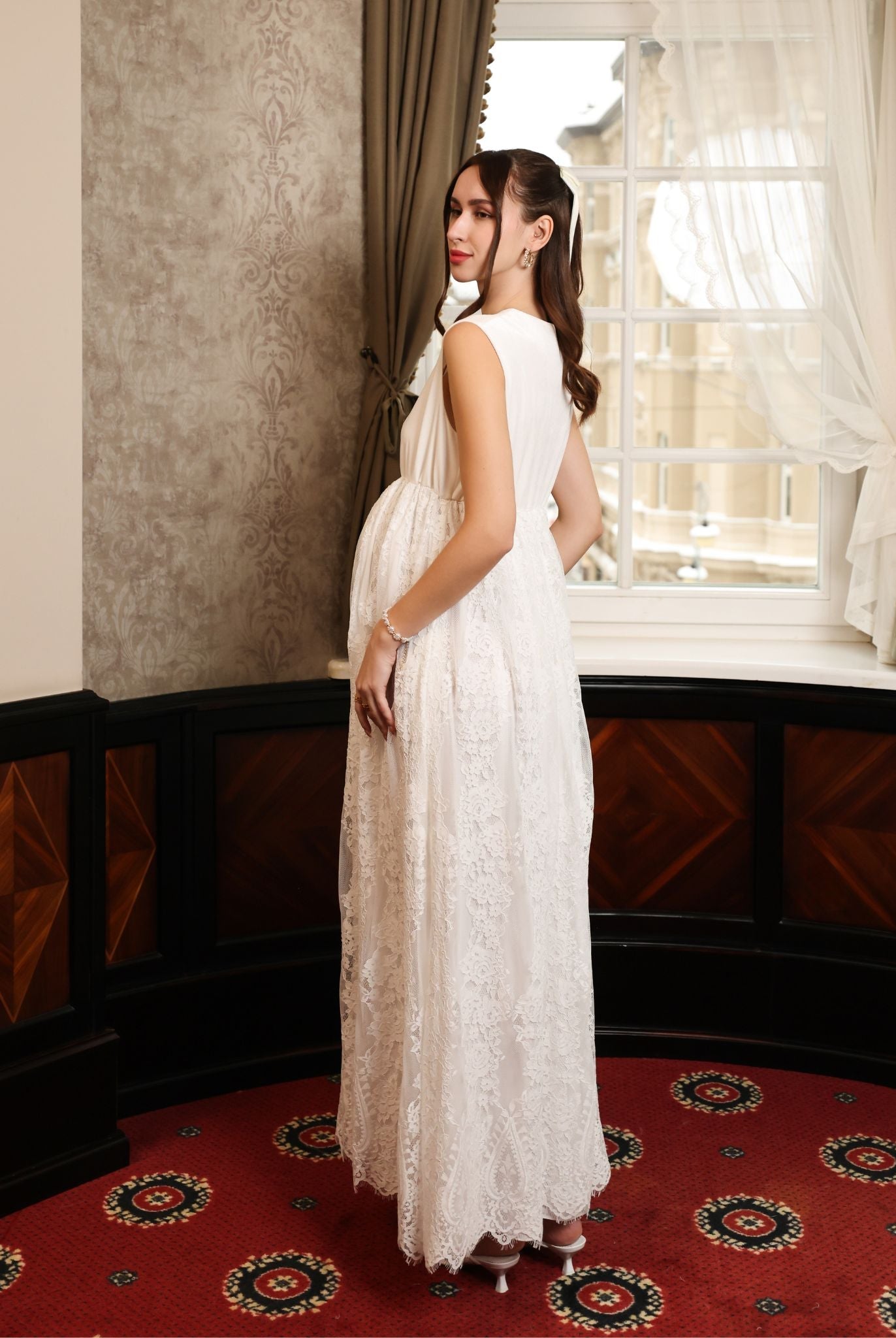 Side perspective of the velvet and lace gown, illustrating how the breathable fabric gently flatters the figure.