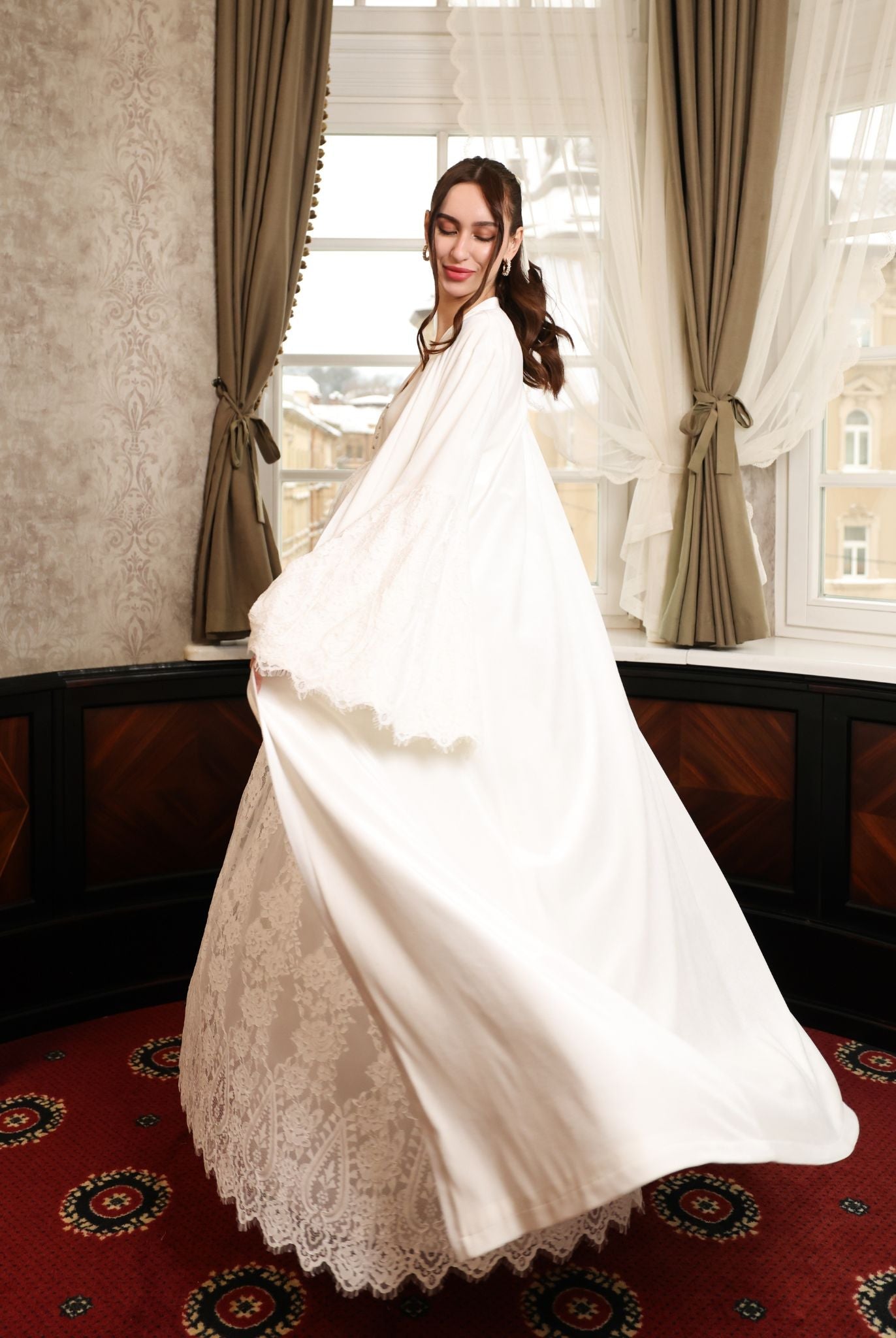 An action shot of the flowing velvet robe, illustrating the ease and soft drama of the premium fabric.