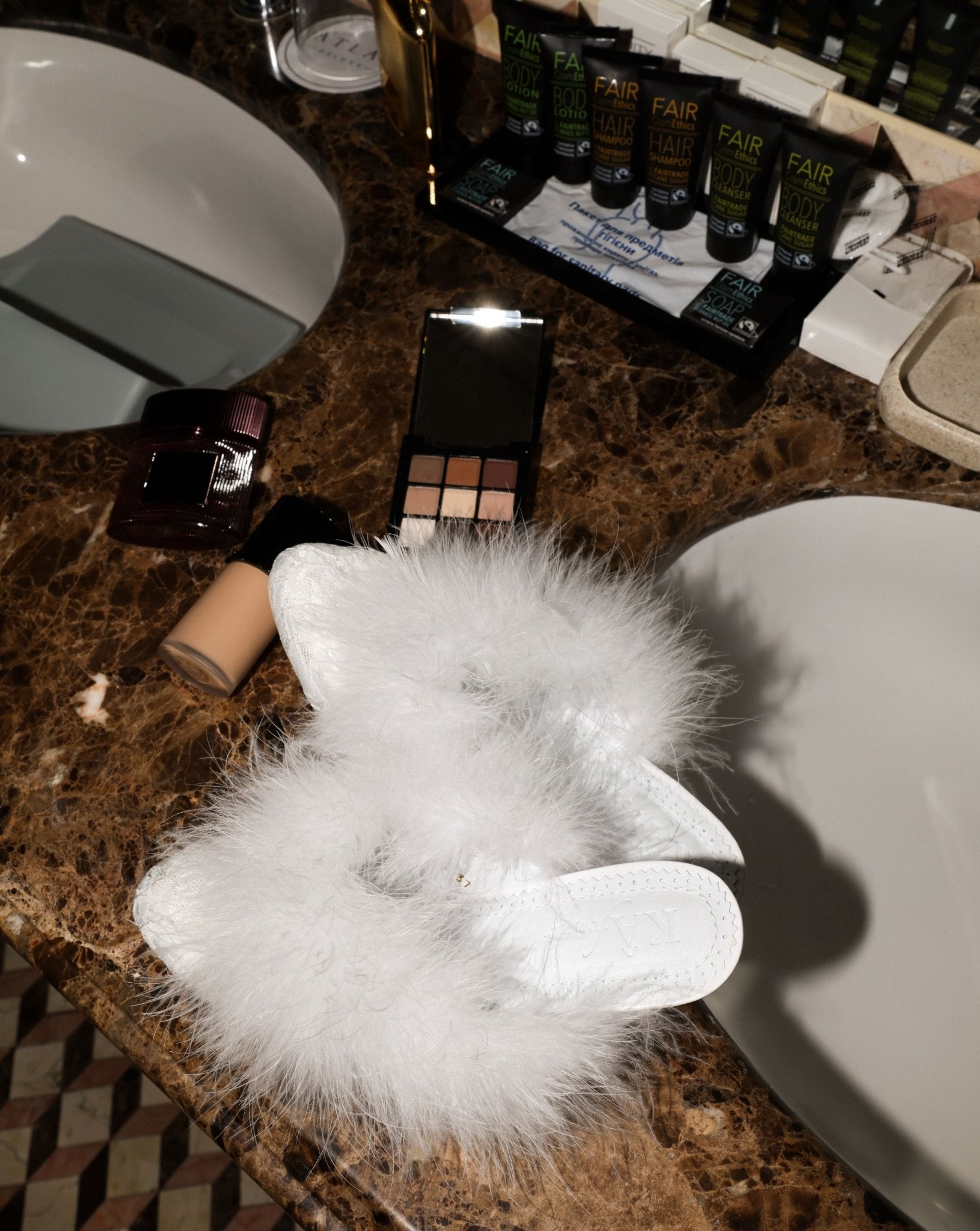 A creative shot of the Heeled Slippers featuring a 4 cm heel, bringing a glamorous touch to the home routine.