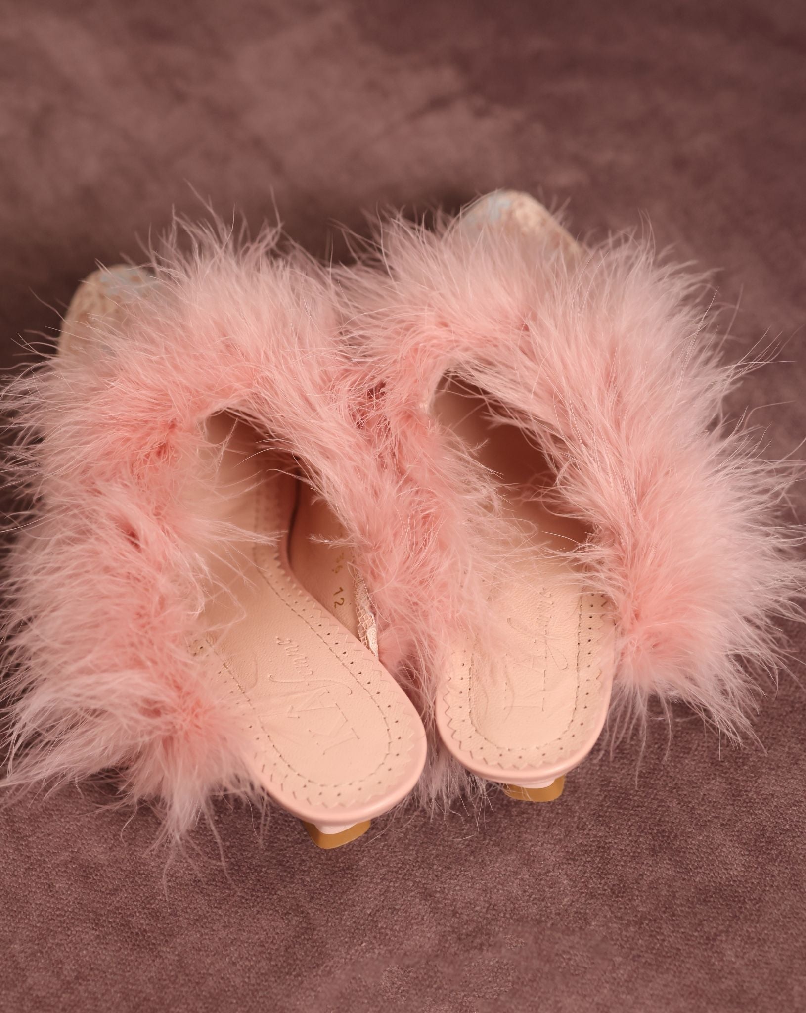 High-angle view of the pair alone, showcasing the genuine leather insole with soft padding for effortless wear.