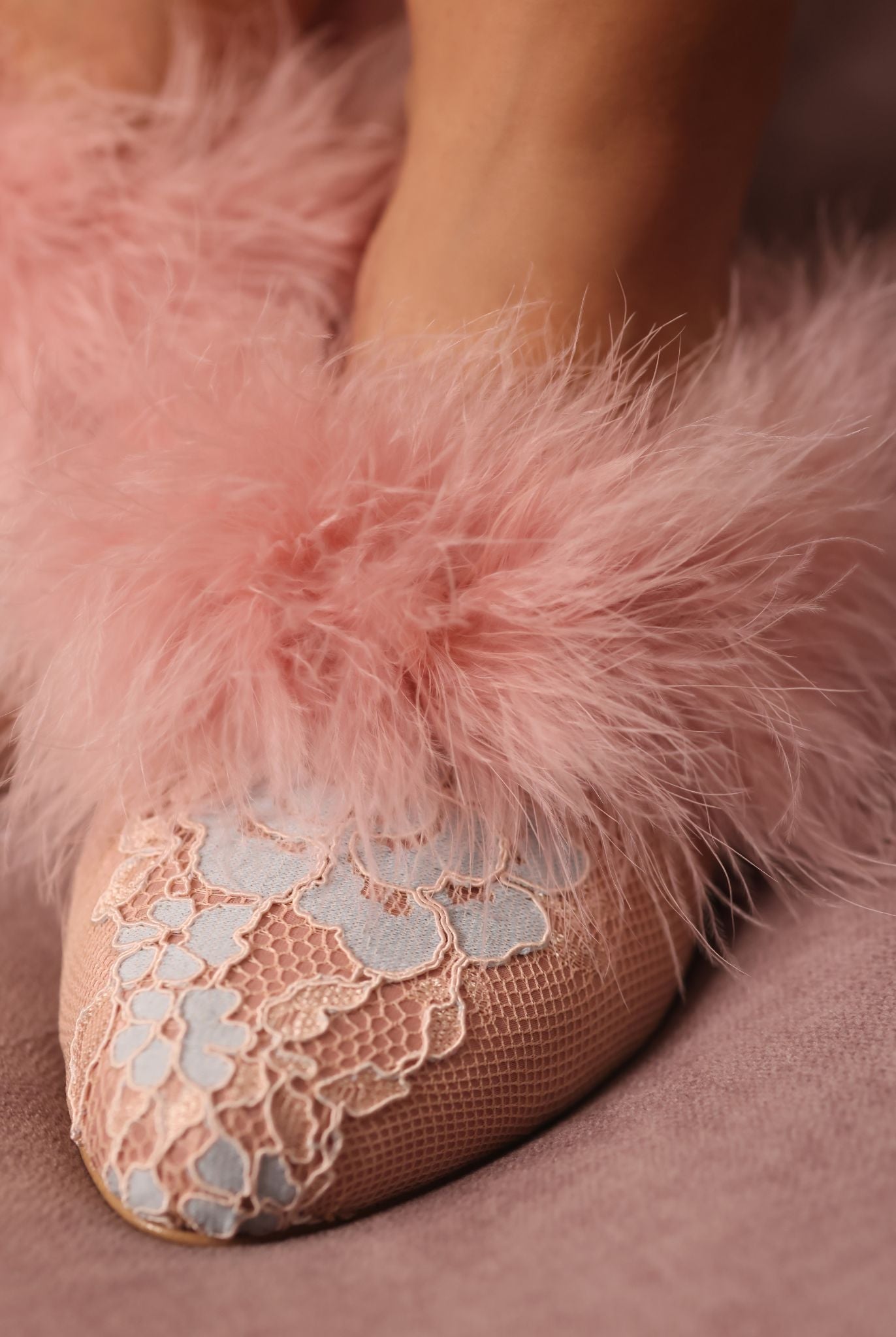 Close-up shot focusing on the meticulous balance of feathers and the smooth, high-quality materials of the slipper.
