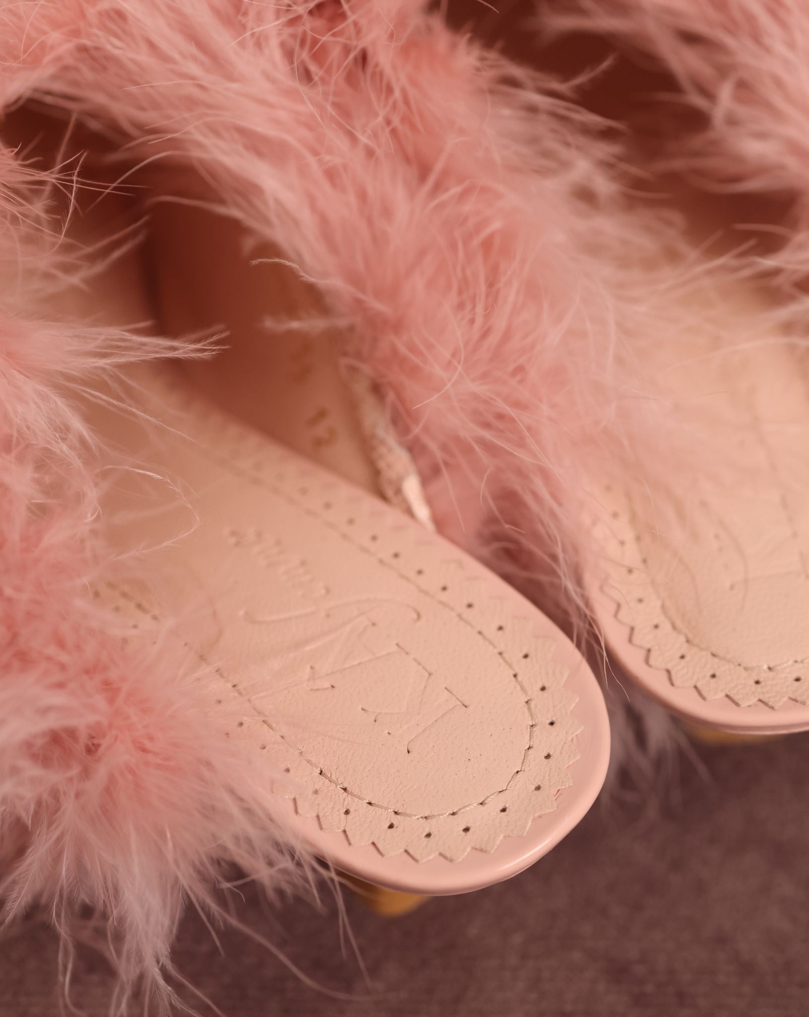 Detailed shot of the KÂfemme logo on the Heeled Slippers, capturing the quiet luxury and refined design.