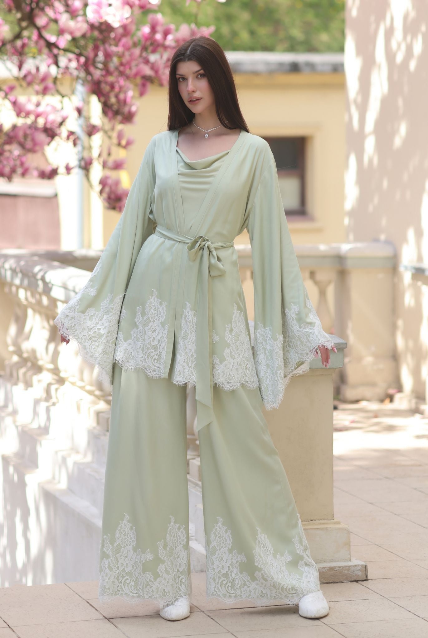 A front view of the kimono-style robe in a wrap-over style, securely tied to showcase a sophisticated silhouette.