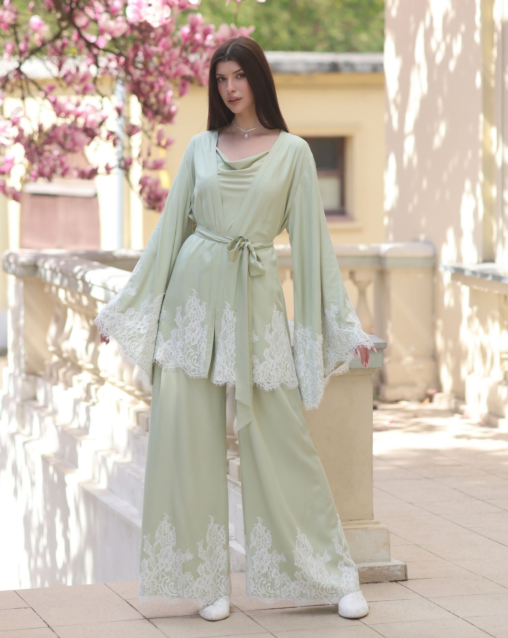 A front view of the kimono-style robe in a wrap-over style, securely tied to showcase a sophisticated silhouette.