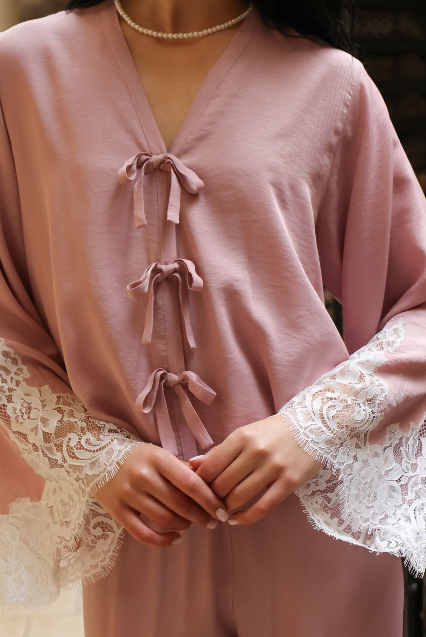 A close-up of the Pajama Pants and Top's upper part, focusing on the delicate bows and lace-detailed sleeves.