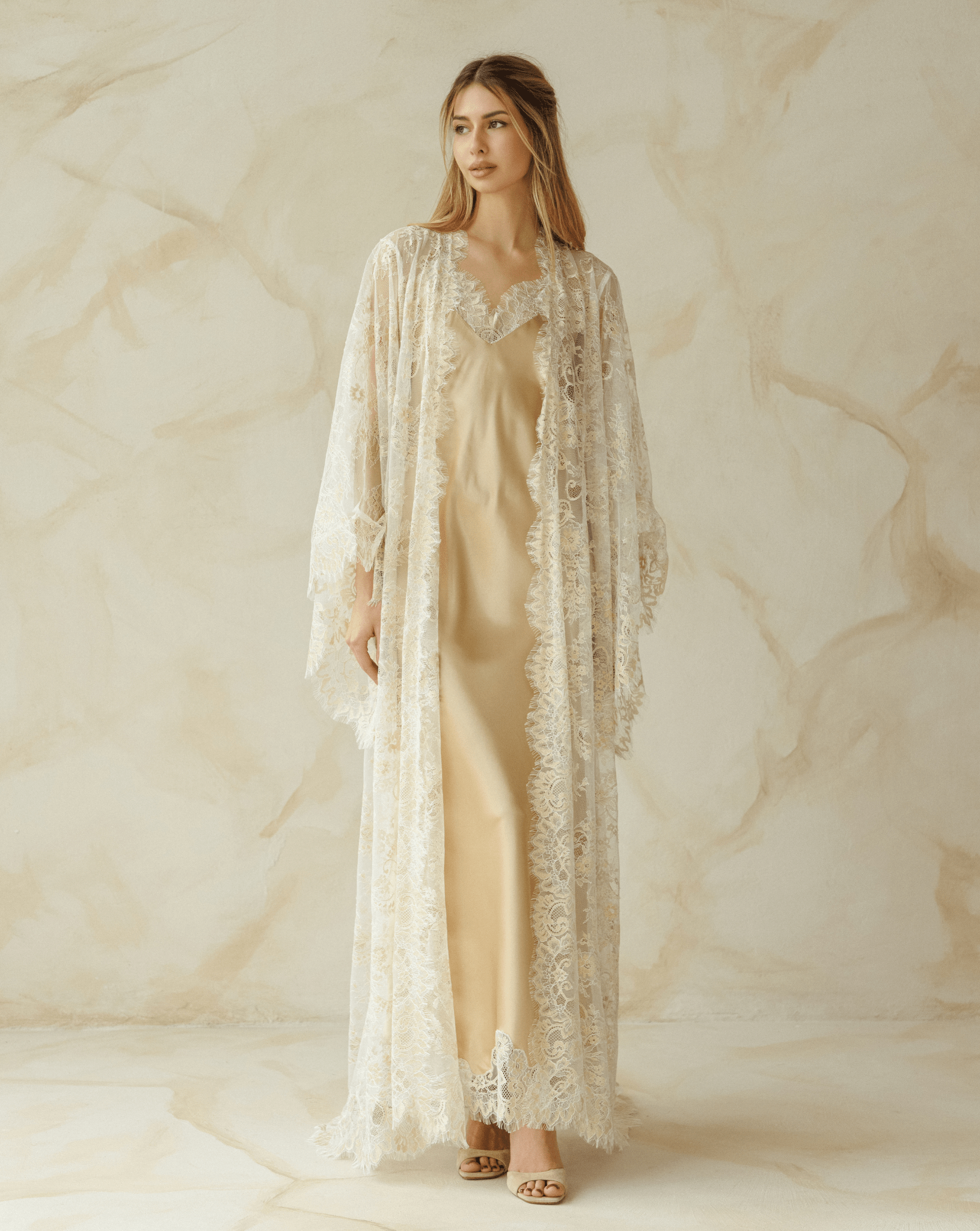 Ivory lace robe over champagne nightgown, part of a refined robe and nightgown set