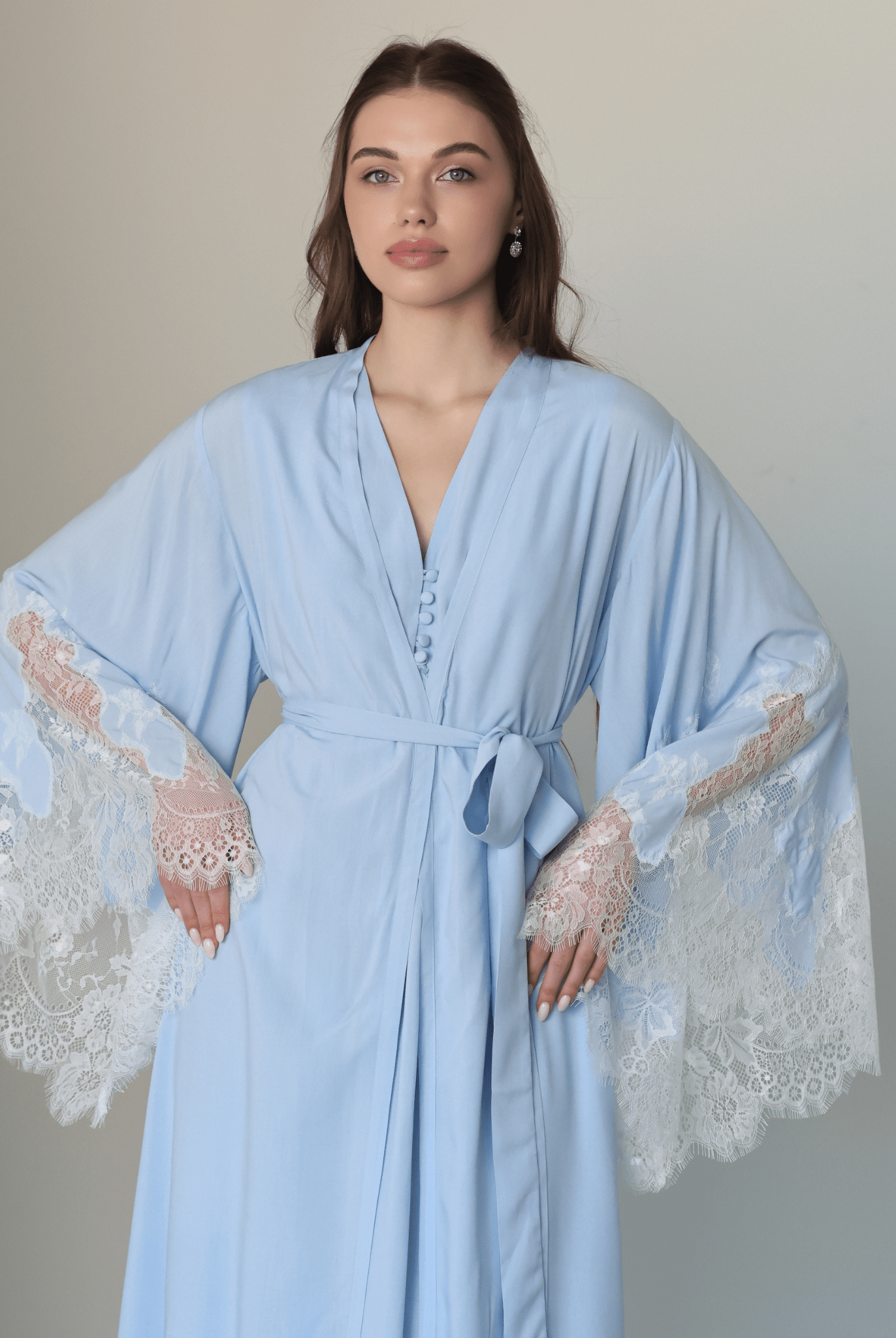 Mid-length shot of the attire, highlighting the wide sleeves with delicate lace ends and a well-put-together look.