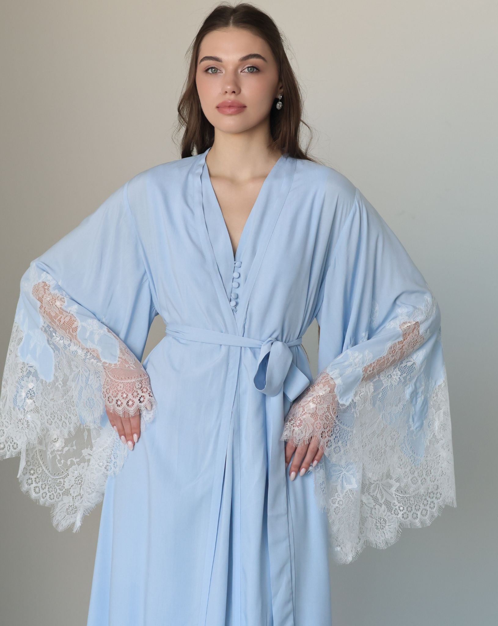 Mid-length shot of the attire tied at the waist, highlighting a well-put-together look for daily wear at home.