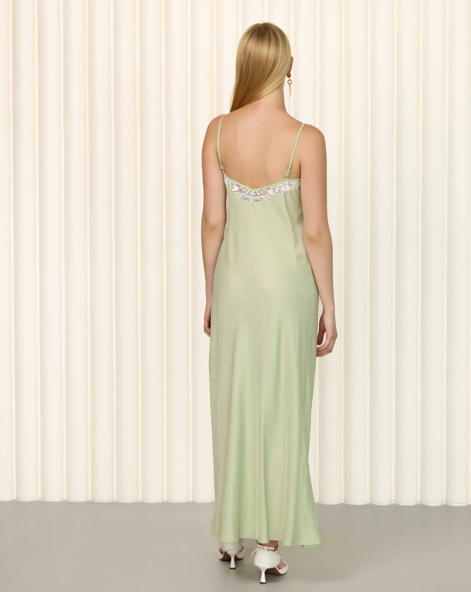 Back view of sage green nightgown with elegant drape