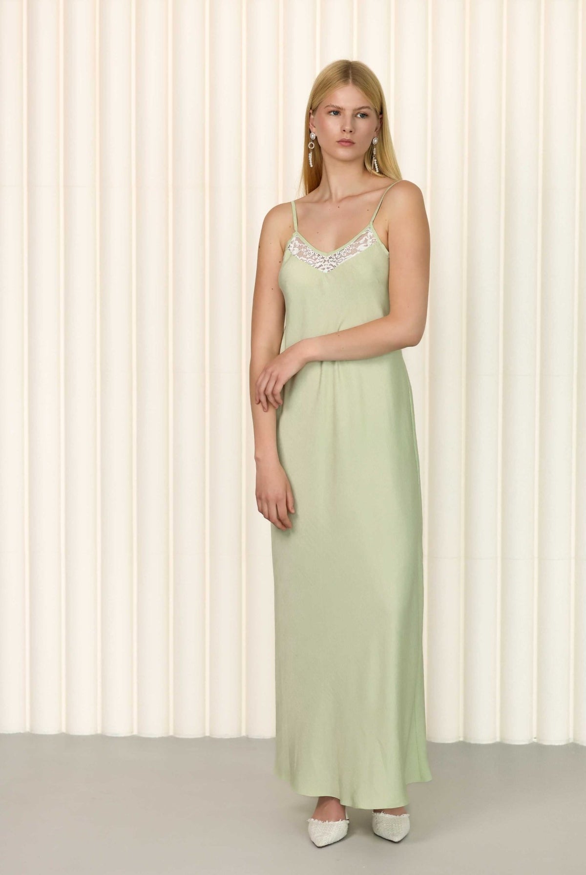 Sage green silk nightgown with lace neckline and sleeveless design
