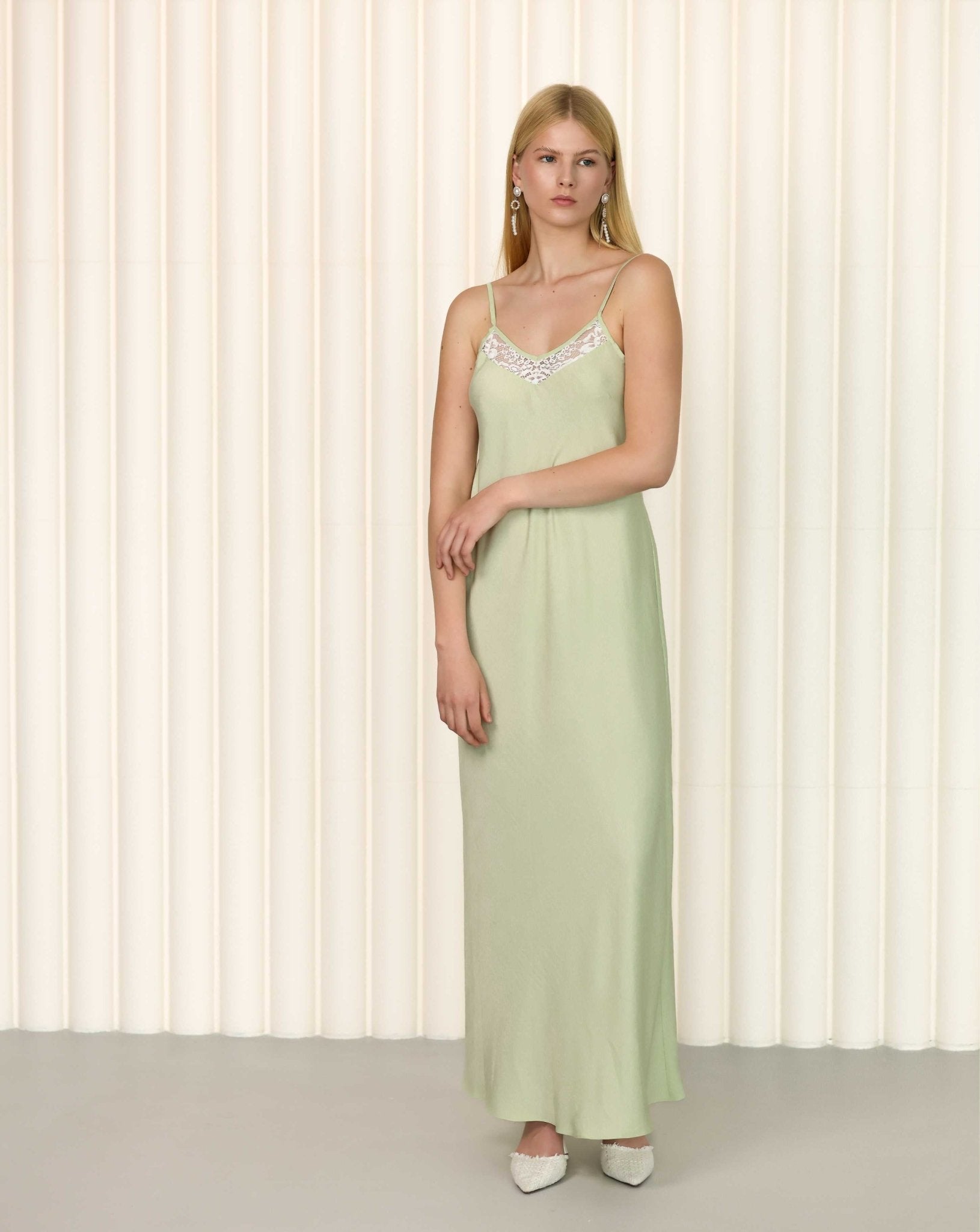Sage green silk nightgown with lace neckline and sleeveless design