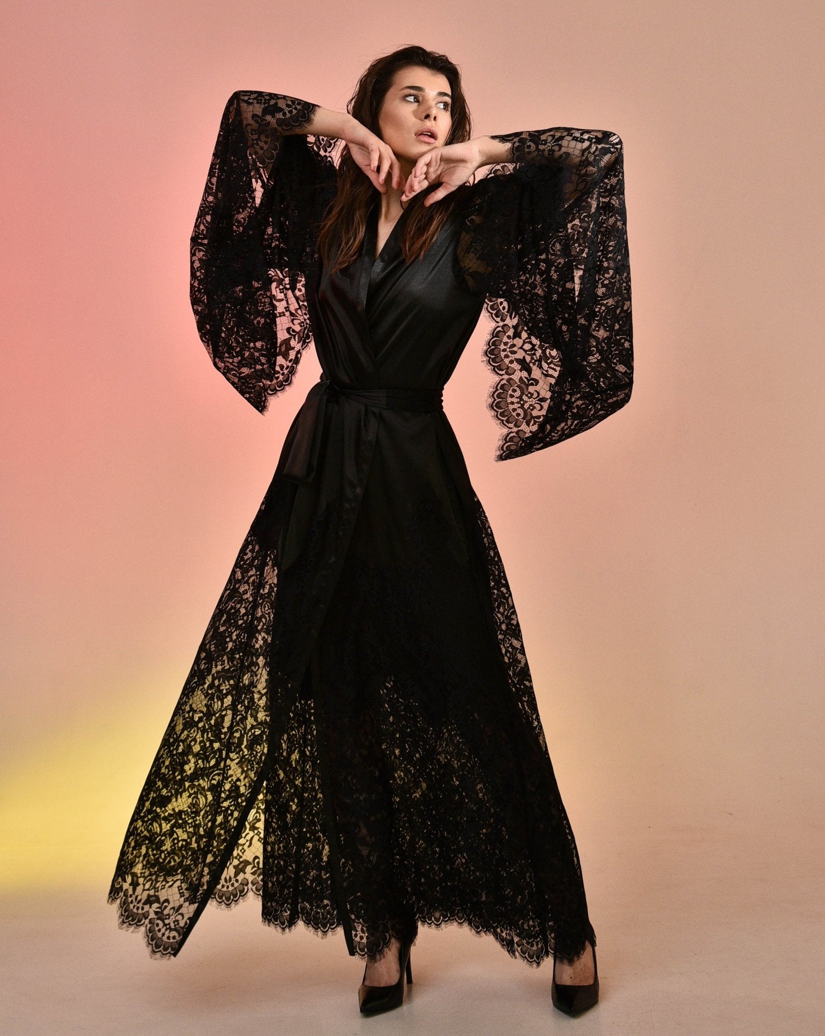 Woman in Dramatic Black Kafemme Lace Ensemble Walking Forward