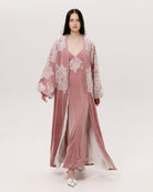 A dynamic view of the flowing silhouette, showcasing how the velvet drapes beautifully during movement.