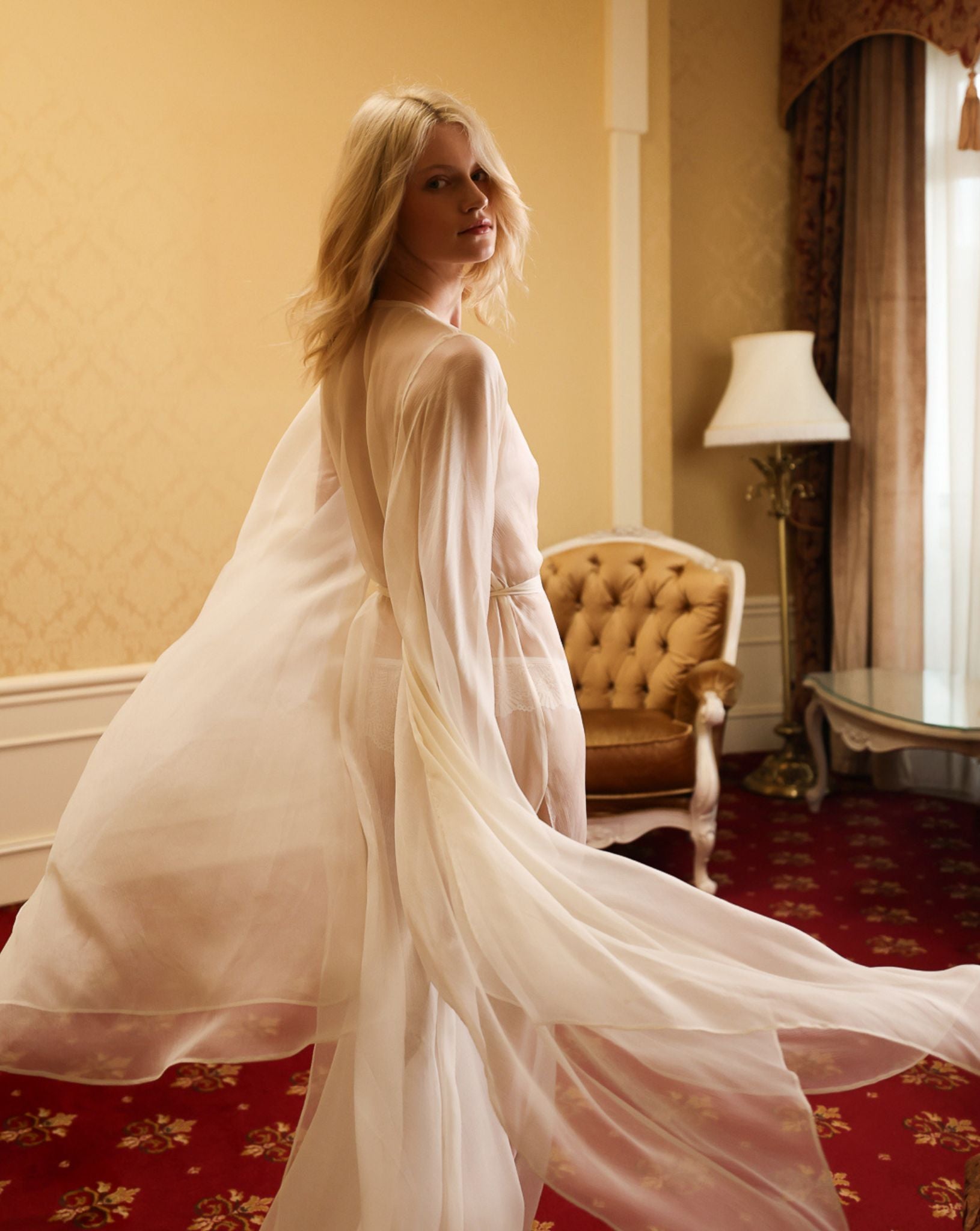 Mid-length shot highlighting the airy texture and graceful movement of the delicate 100% mulberry silk fabric.