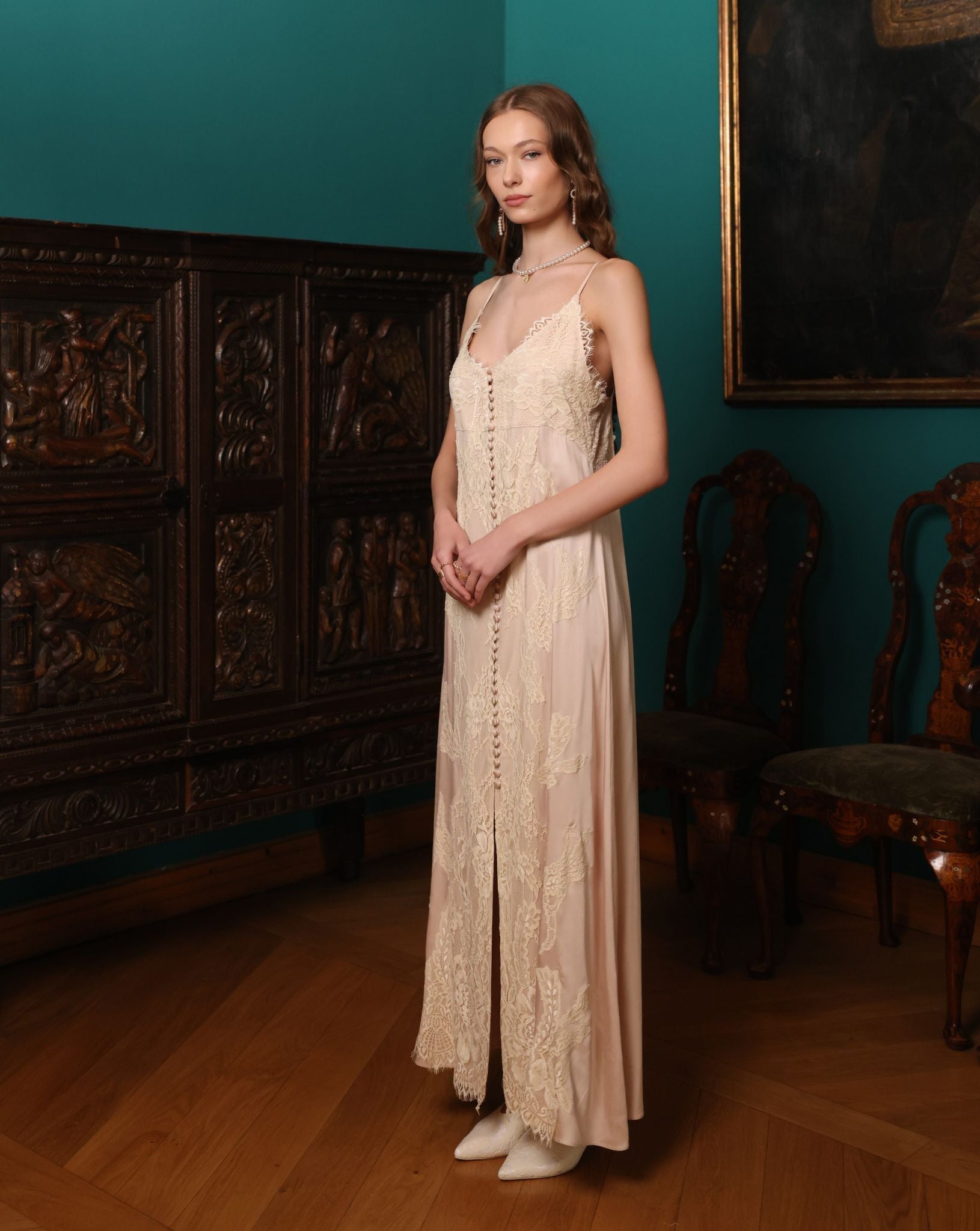 Side perspective of the nightdress, illustrating the soft, luminous texture and the flattering, airy shape.
