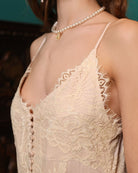 A close-up of the Robe and Nightgown Set's top, focusing on the lace-trimmed neckline and button-down front.