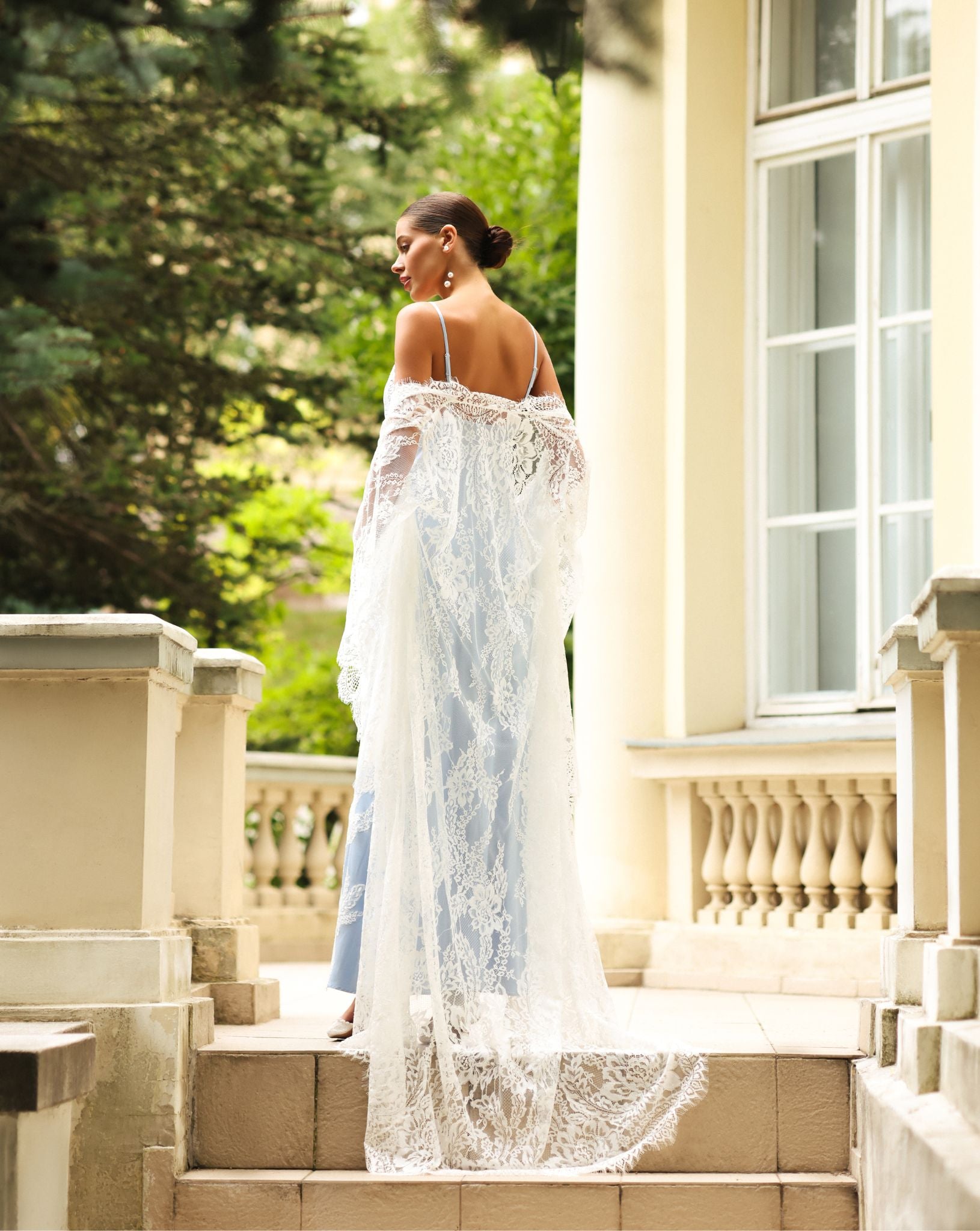 Flowing bridal set by Kafemme in soft white lace, photographed on a sunlit terrace