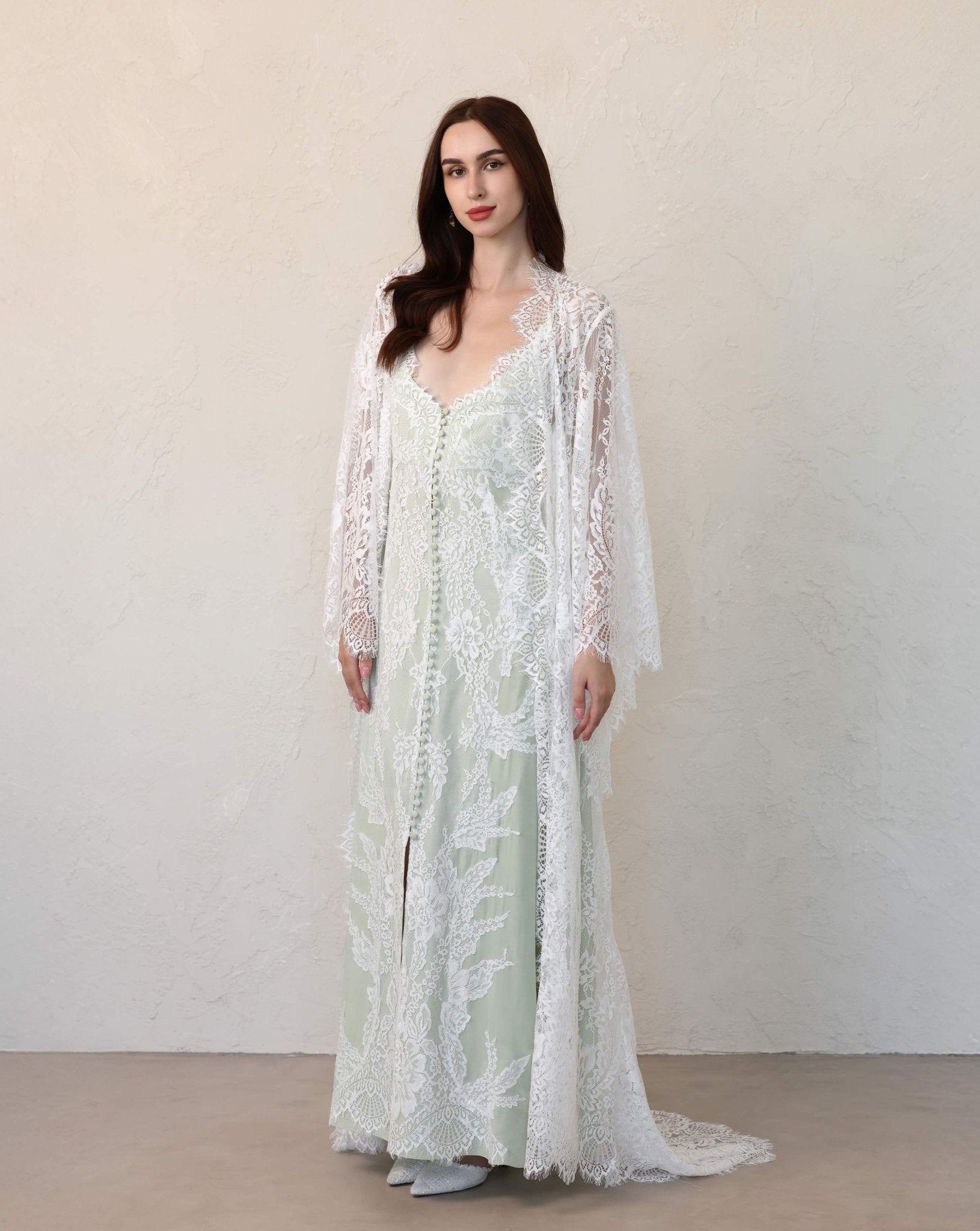 Kafemme full-length robe and matching dress in lace, styled in a minimalist indoor setting