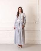 Static full-length view of a modest nightdress with long sleeves and elegant floral lace inserts.
