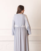 Rear view of a long-sleeved modest nightdress, emphasizing the loose fit and graceful floor-length cut.