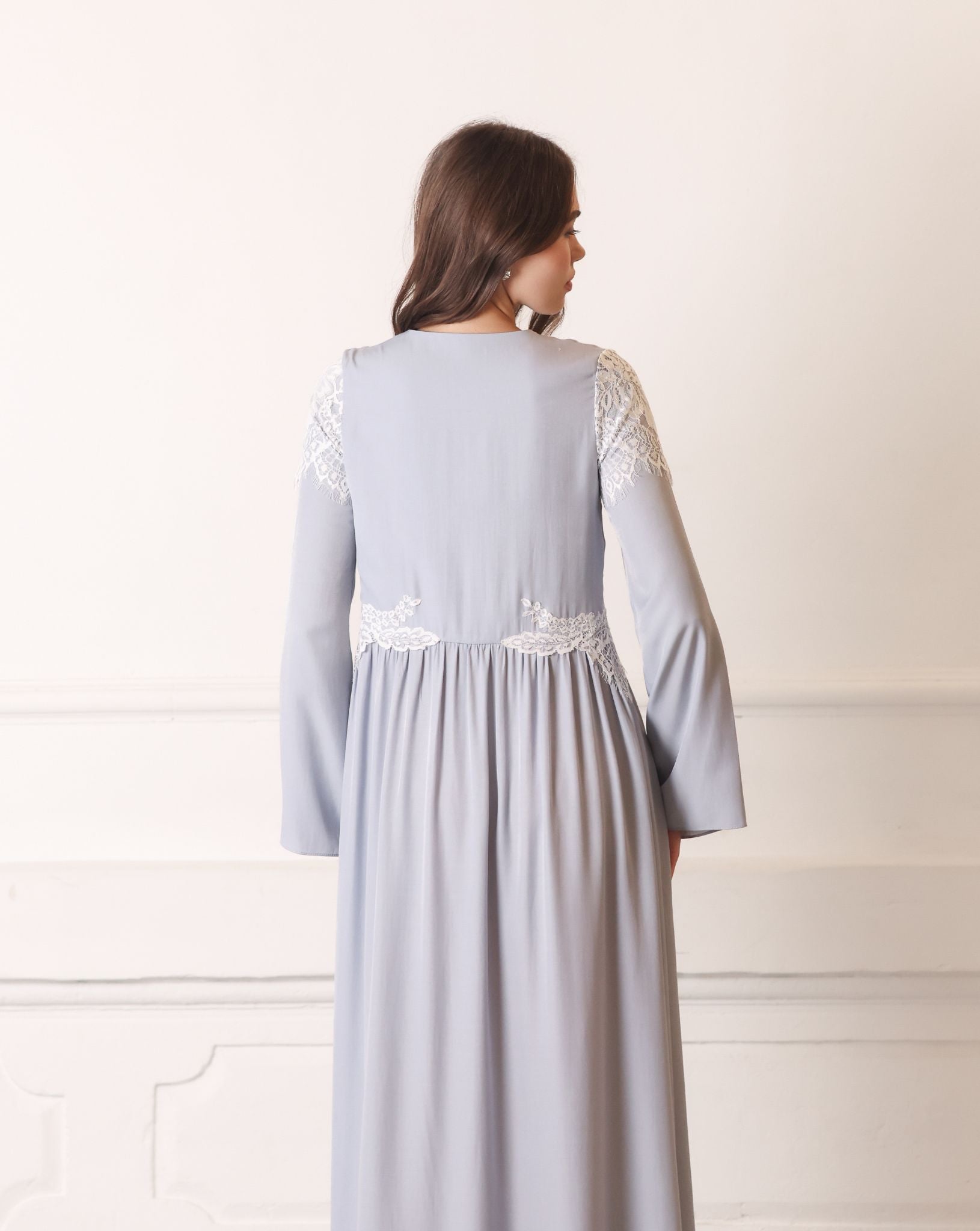 Rear view of a long-sleeved modest nightdress, emphasizing the loose fit and graceful floor-length cut.