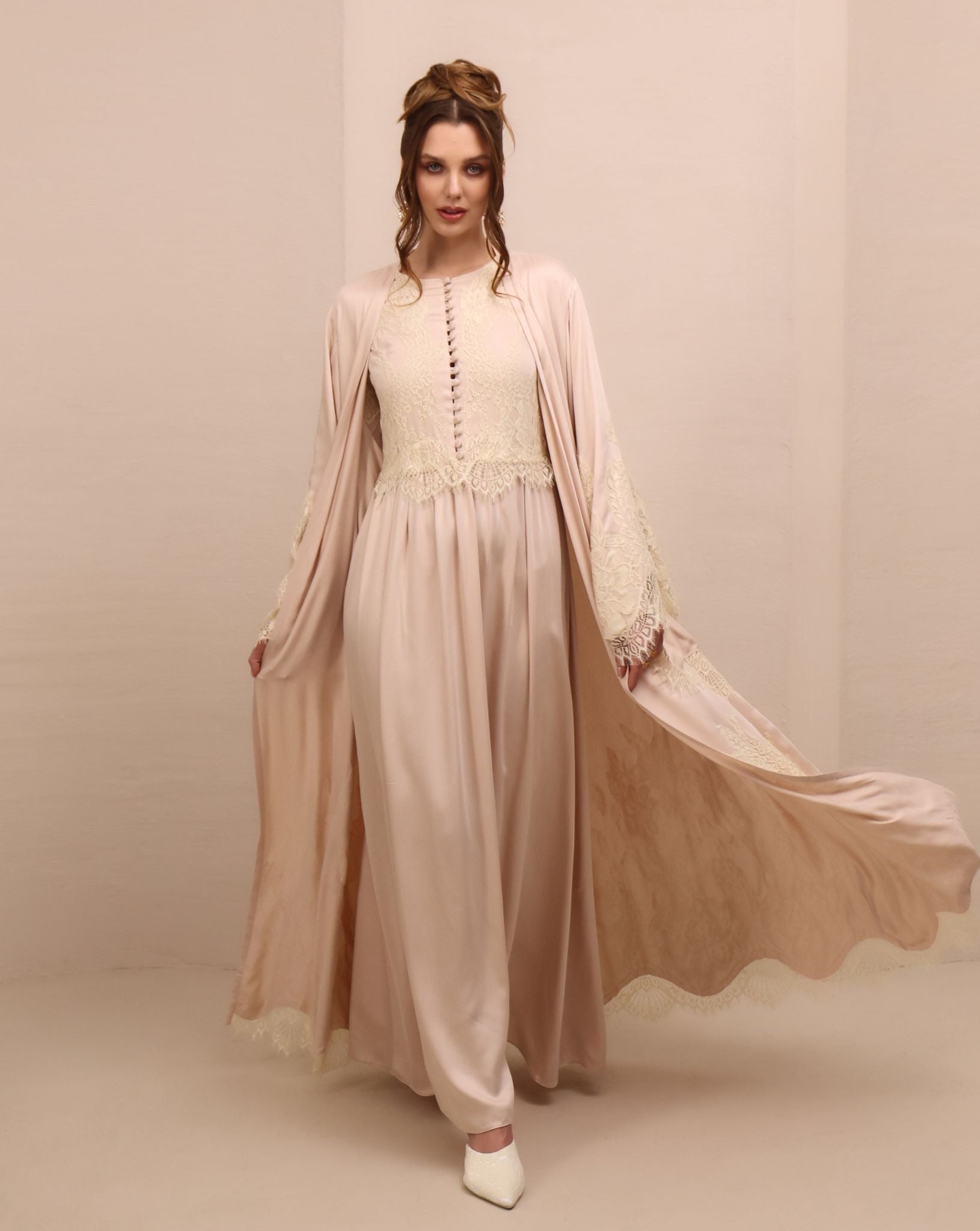 A dynamic motion shot of the Robe and Nightgown Set, capturing the floor-length cut and airy movement.