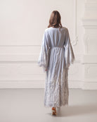 Rear view of the complete ensemble, emphasizing the generous volume and high-quality French lace.