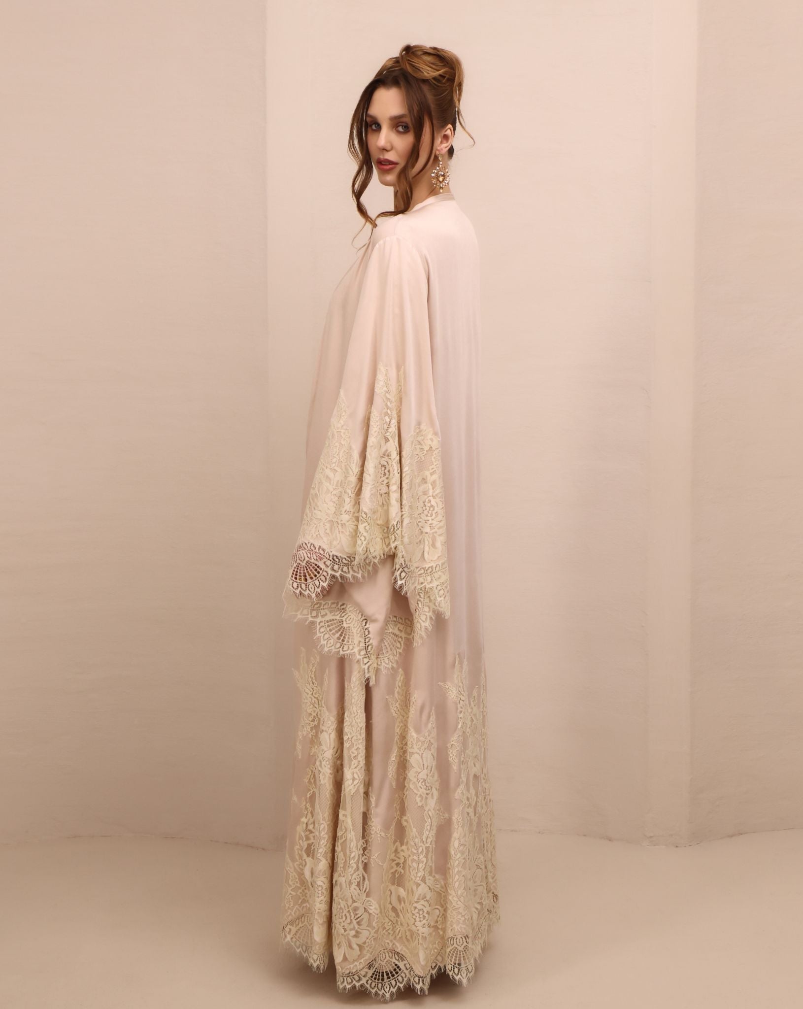 Side perspective of the open ensemble, showcasing the wide sleeves decorated with soft floral French lace.