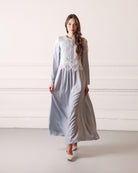 Graceful walk in a viscose nightgown, featuring delicate lace embroidery and a feminine, relaxed look.