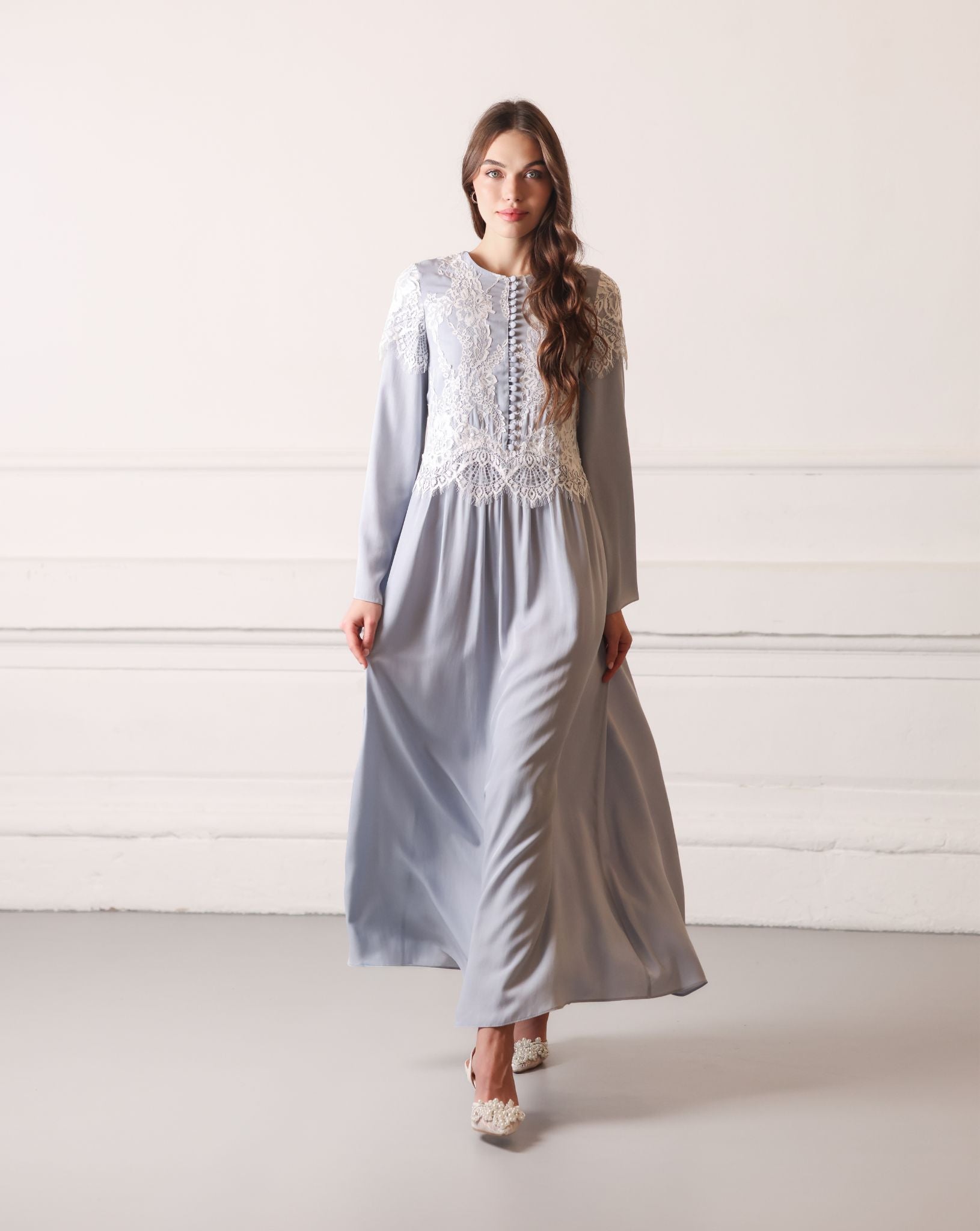 Graceful walk in a viscose nightgown, featuring delicate lace embroidery and a feminine, relaxed look.