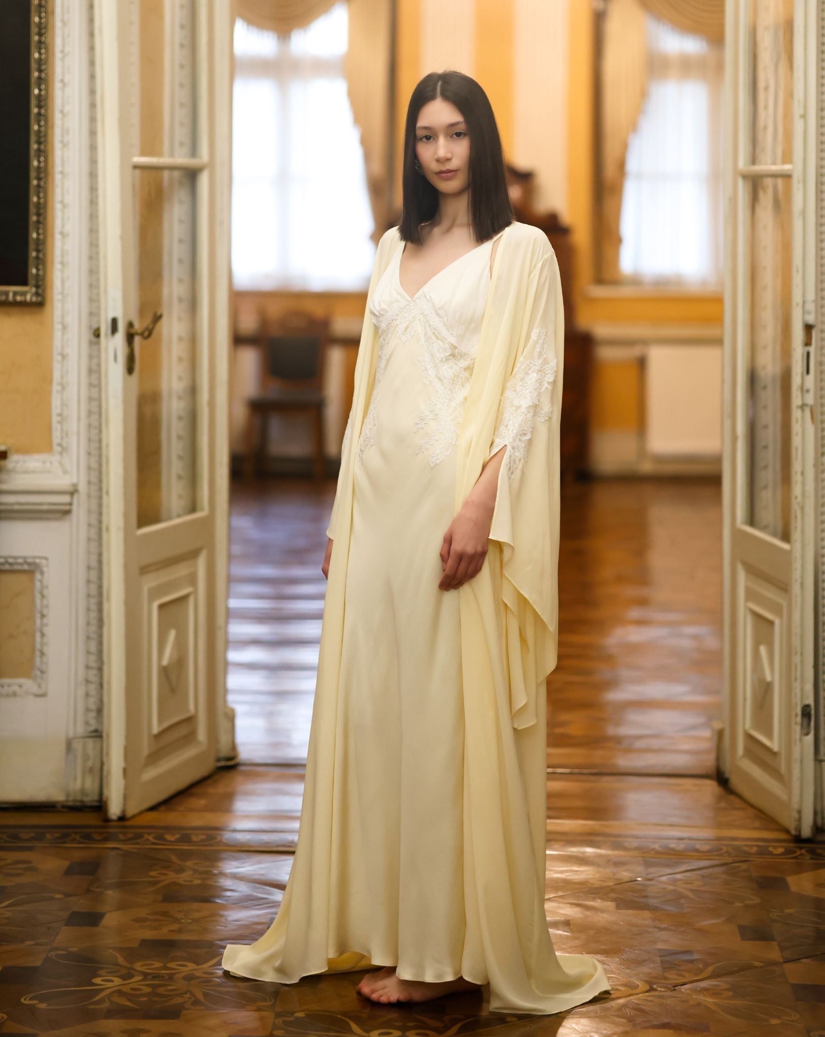 Side perspective of the attire, illustrating how the bias-cut fabric glides effortlessly along the body.