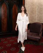 A full-length view of the Robe and Nightgown Set in motion, showcasing the sheer lace and fluid bell sleeves.