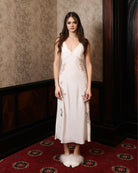Full-length view of the nightdress, highlighting the bold asymmetrical lace border at the hemline.