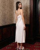 Rear view of the sleeveless nightgown, showcasing the waterfall open back and the fluid drape of the viscose fabric.
