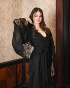 Side shot of the tied robe, showing how the high-quality lace provides a sophisticated and elongated silhouette.