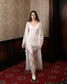 Motion shot of the floor-length lace attire, emphasizing breathability and the natural flow of the fabric.