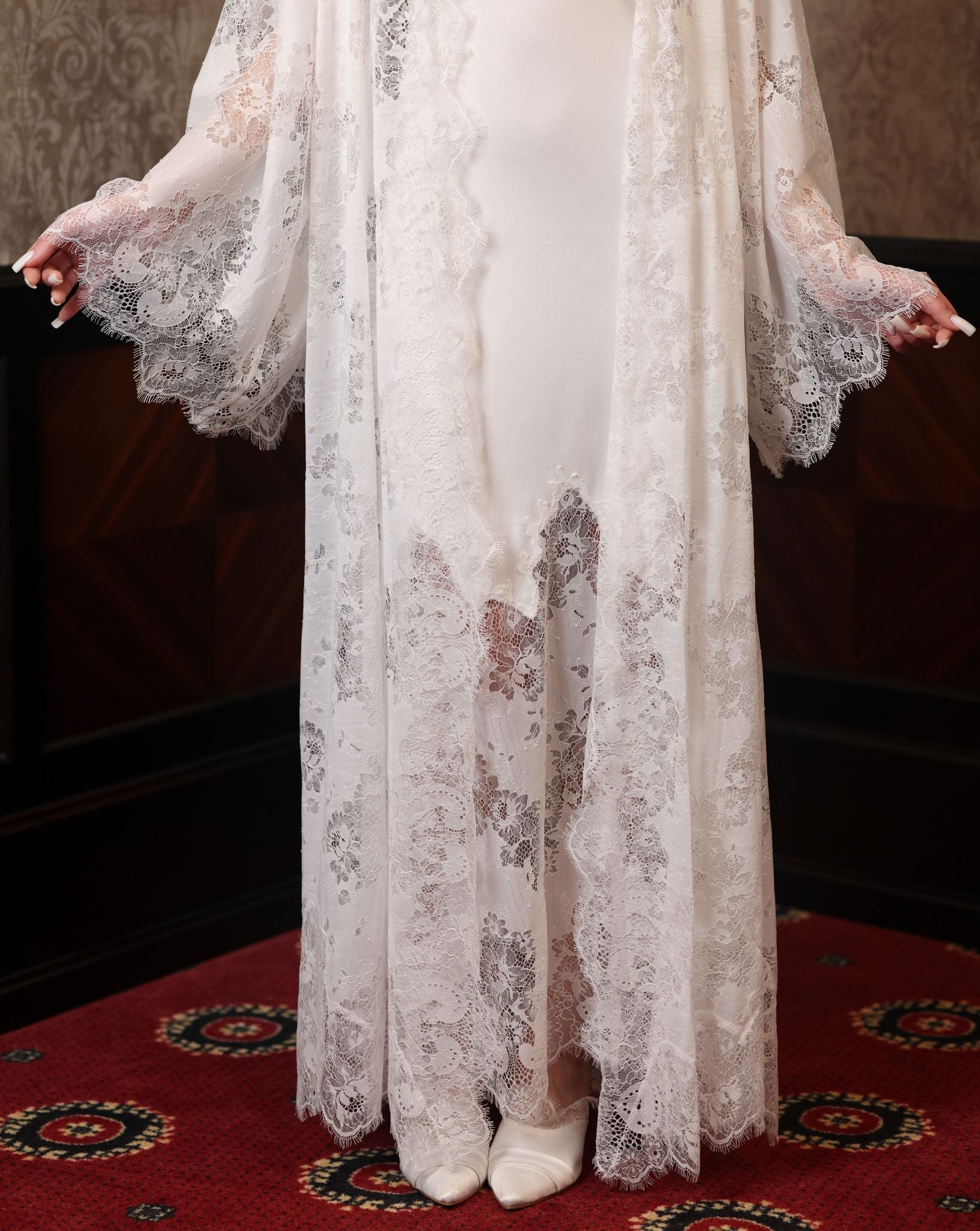 Detailed view of the lower part of the layered set, illustrating the soft movement of the lace and cotton.